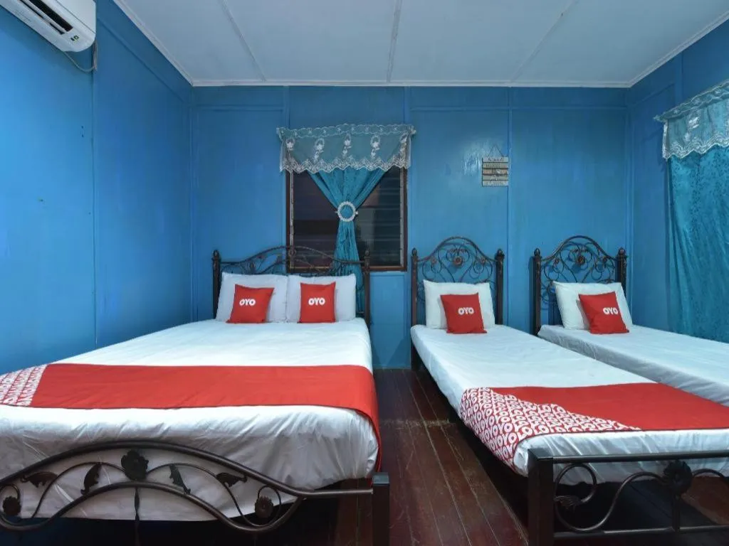 Bed in OYO 90620 Mahseer Chalet