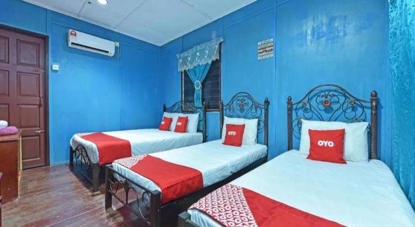 Bed in OYO 90620 Mahseer Chalet