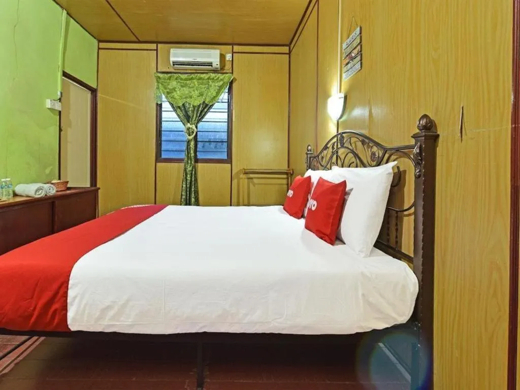 Bed in OYO 90620 Mahseer Chalet