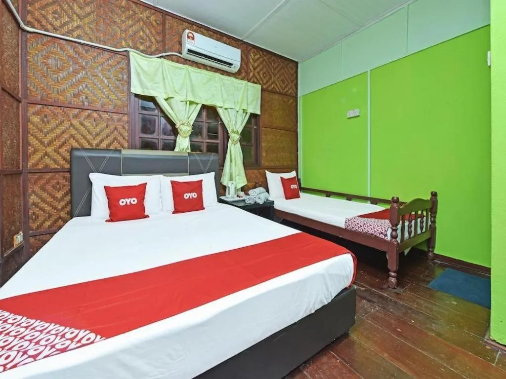 Bed in OYO 90620 Mahseer Chalet