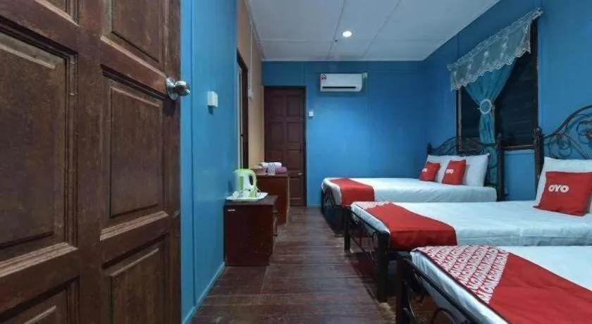 Bed in OYO 90620 Mahseer Chalet