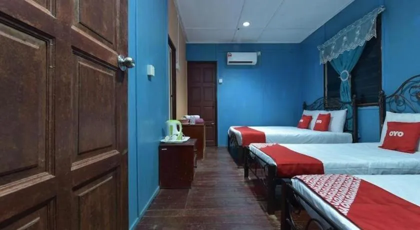 Bed in OYO 90620 Mahseer Chalet