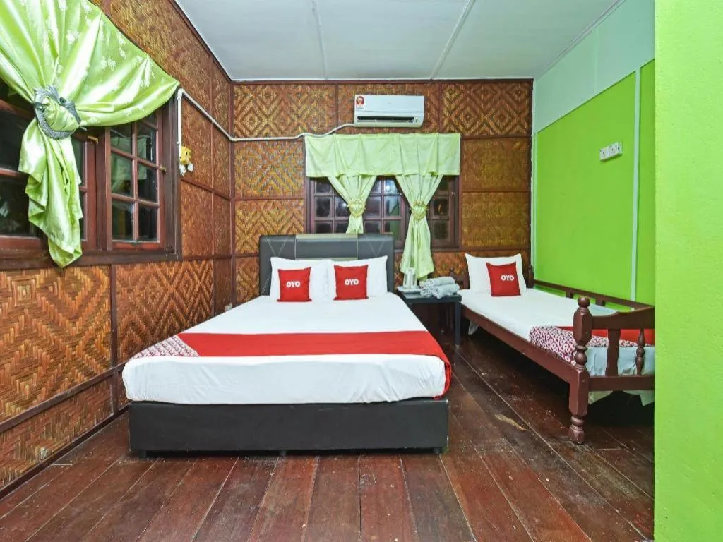 Bed in OYO 90620 Mahseer Chalet