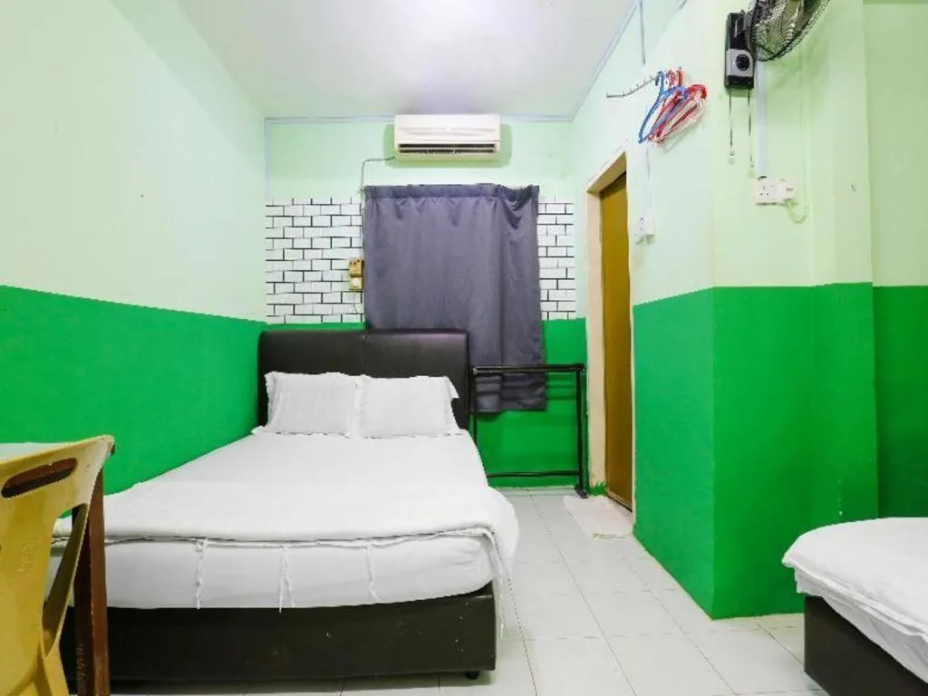 Bed in OYO 90623 Thank Q Inn 3