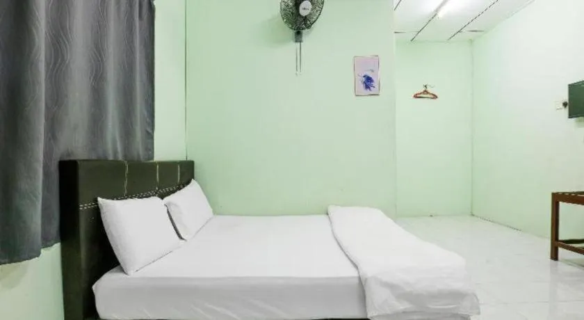 Bed in OYO 90623 Thank Q Inn 3