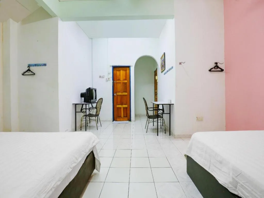 Bed in OYO 90623 Thank Q Inn 3