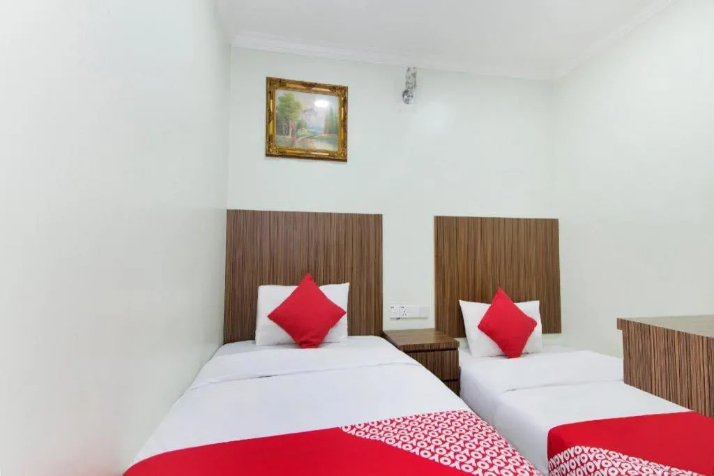 Bed in OYO 90623 Thank Q Inn 3