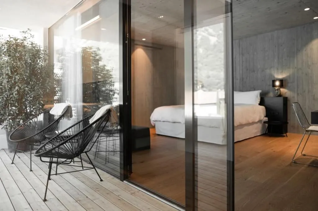 Photo of the whole room, Bed in Design Hotel Tyrol