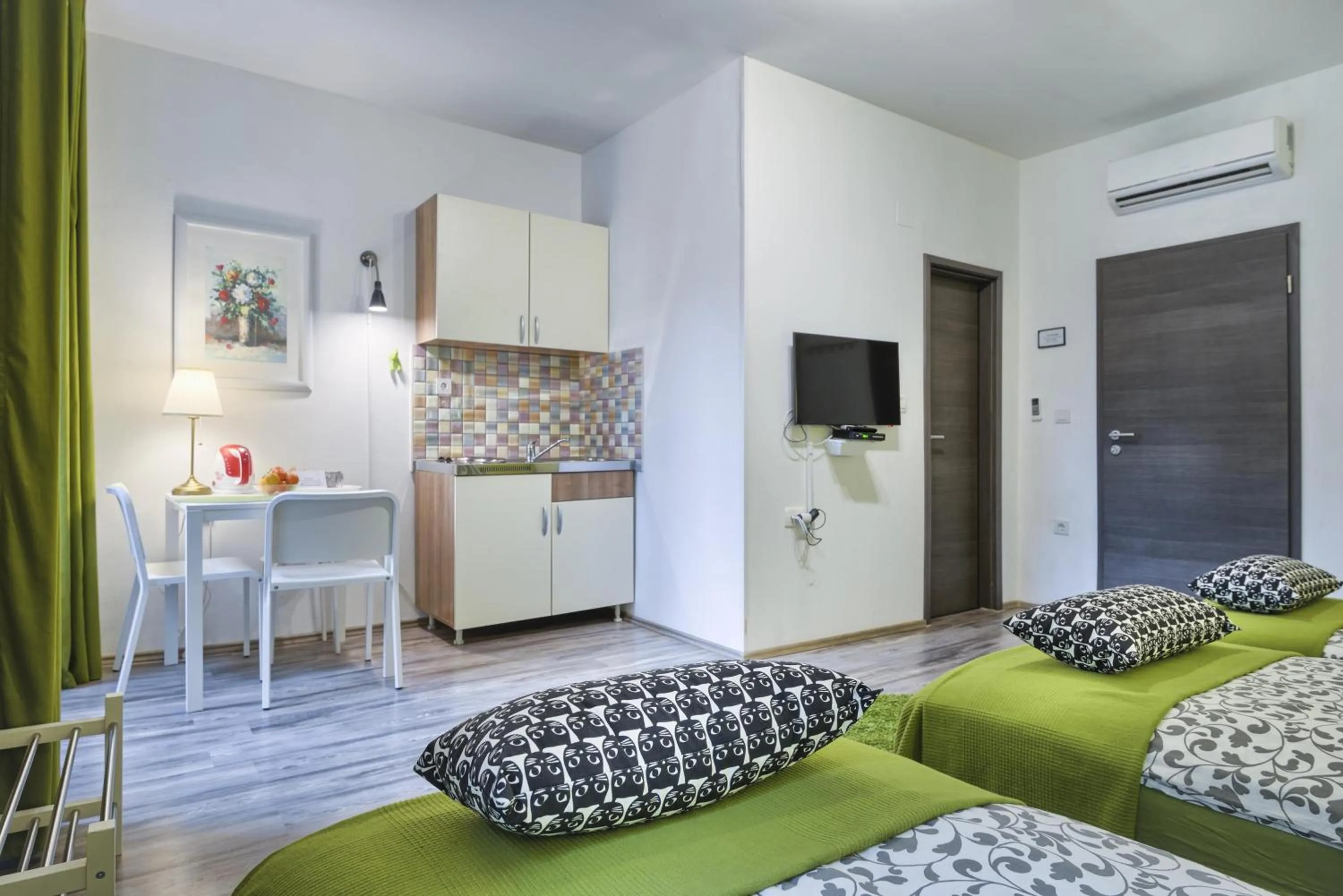 Photo of the whole room, Bed in Top Center Rooms & Studio