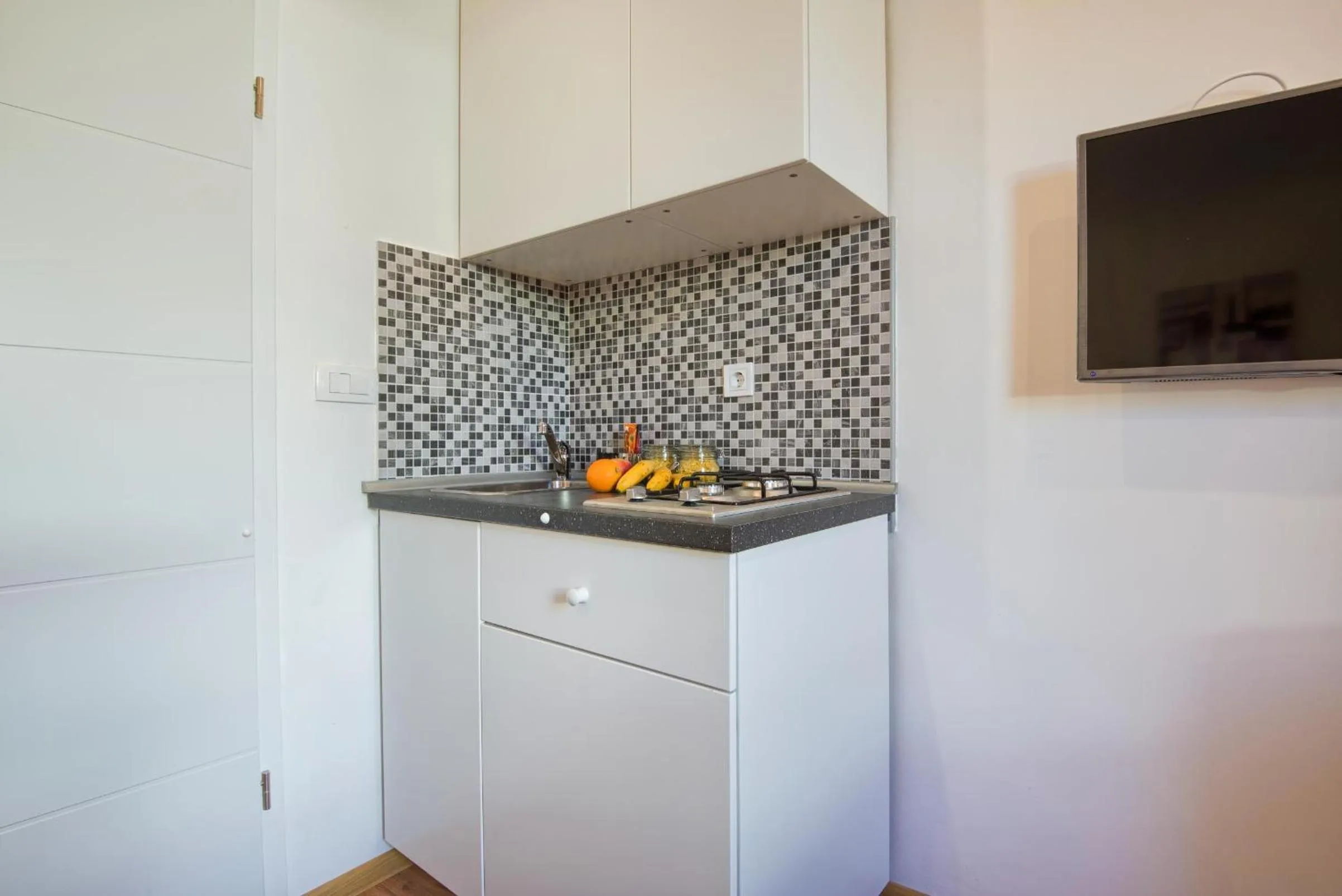 Kitchen or kitchenette in Top Center Rooms & Studio