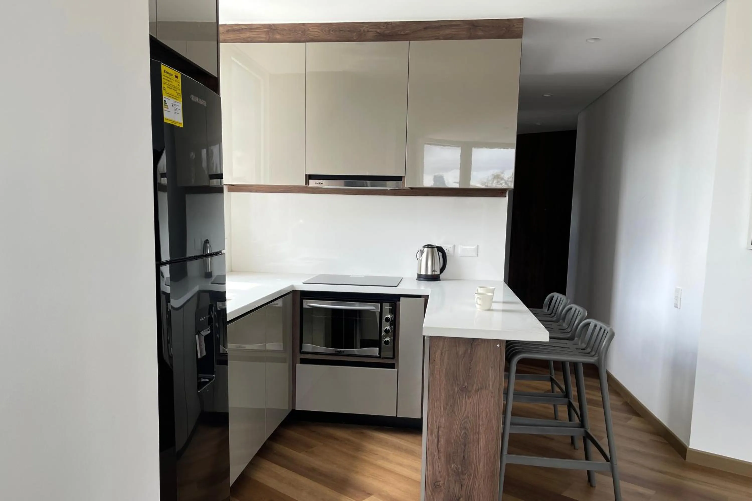 Kitchen or kitchenette in VOU Suites by Avia Suites