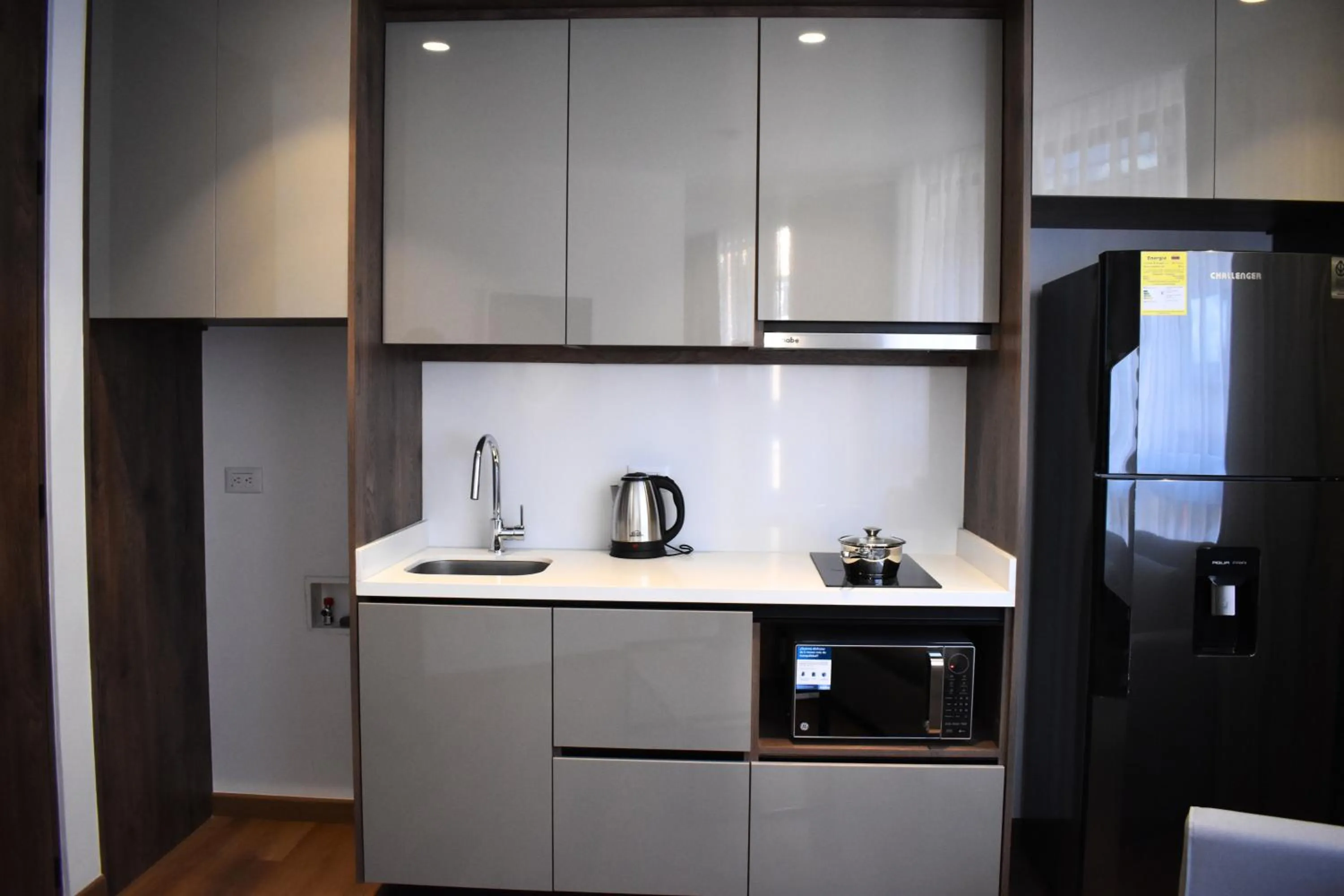 Kitchen or kitchenette in VOU Suites by Avia Suites