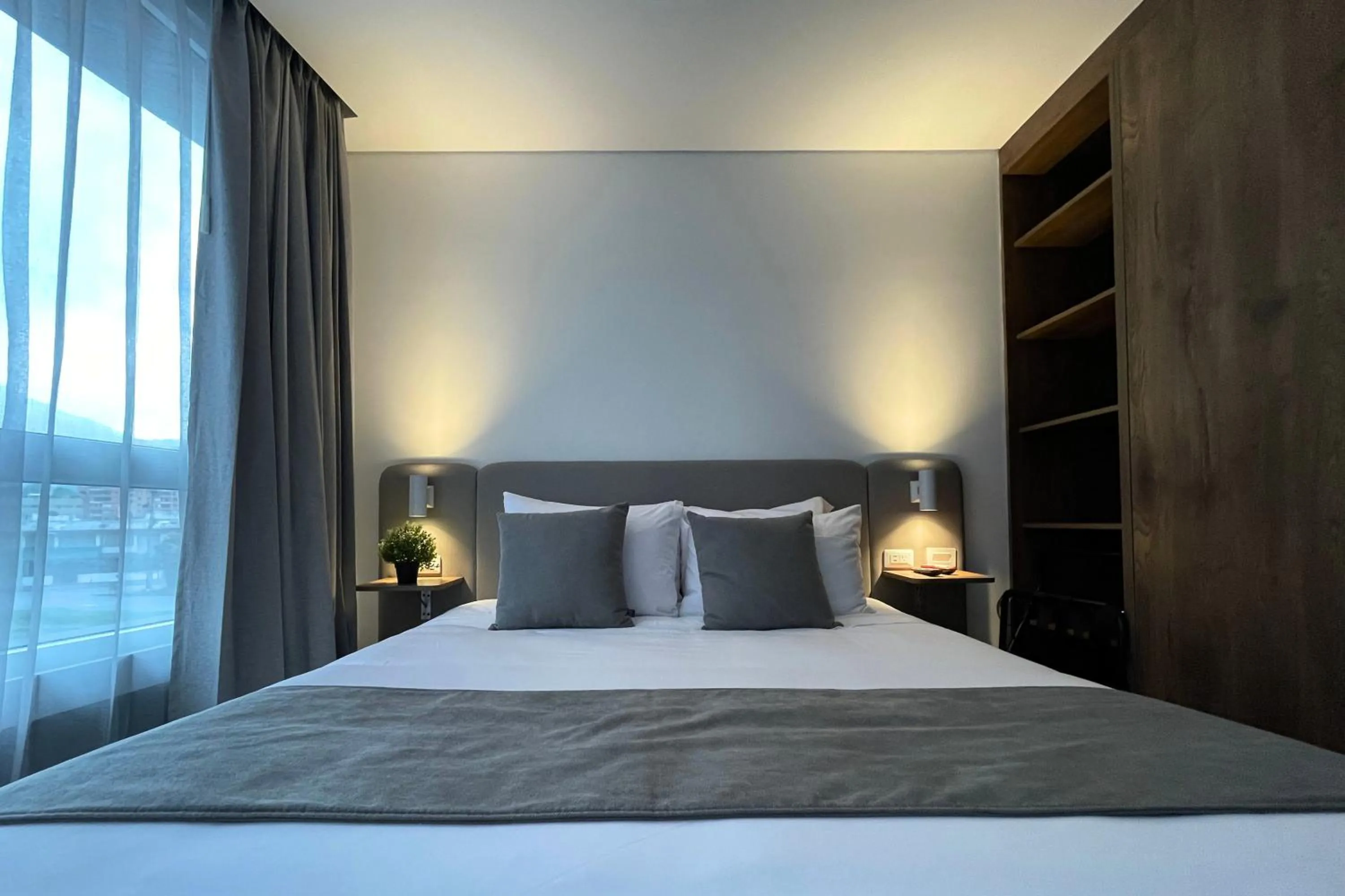 Bed in VOU Suites by Avia Suites