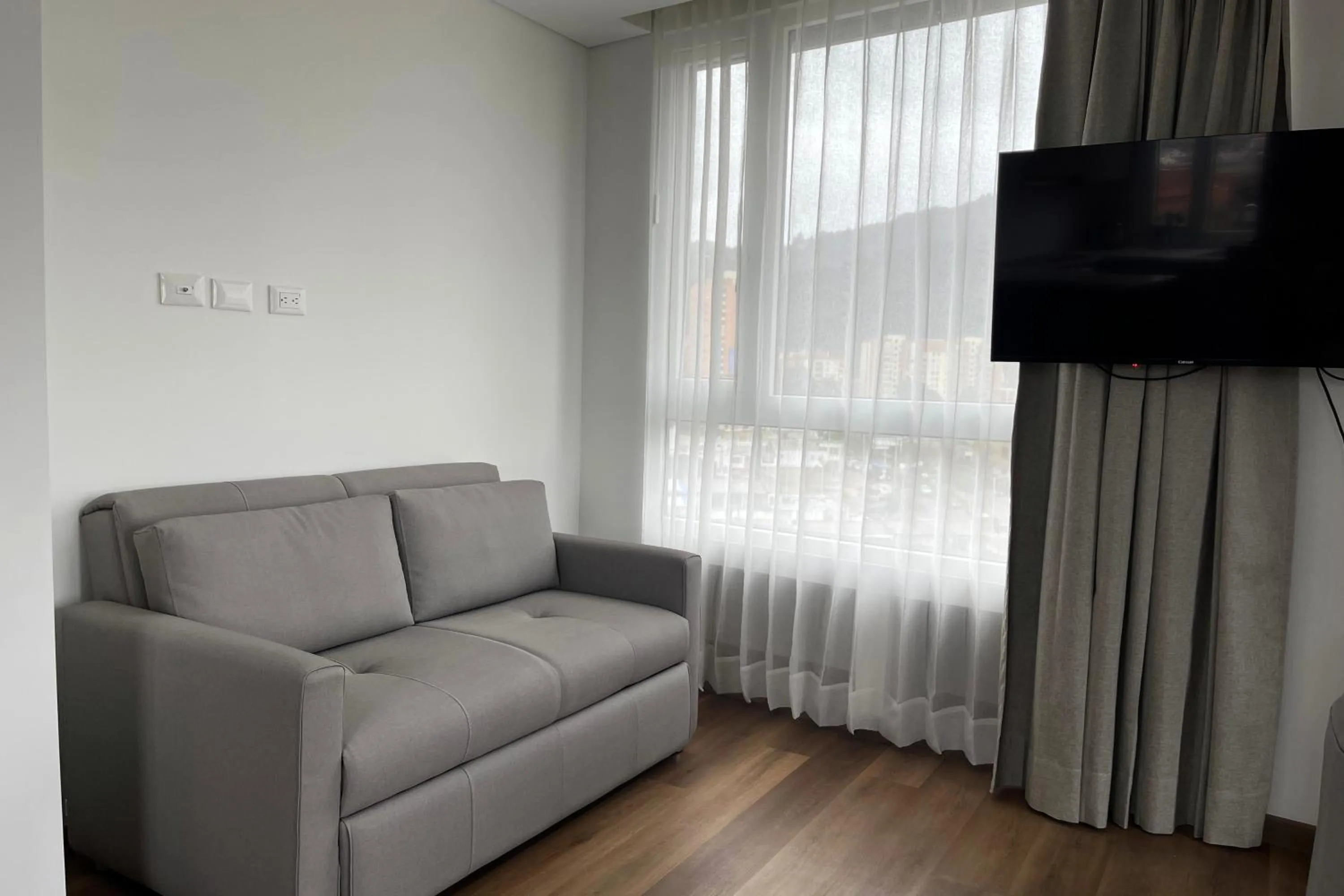 Living room in VOU Suites by Avia Suites