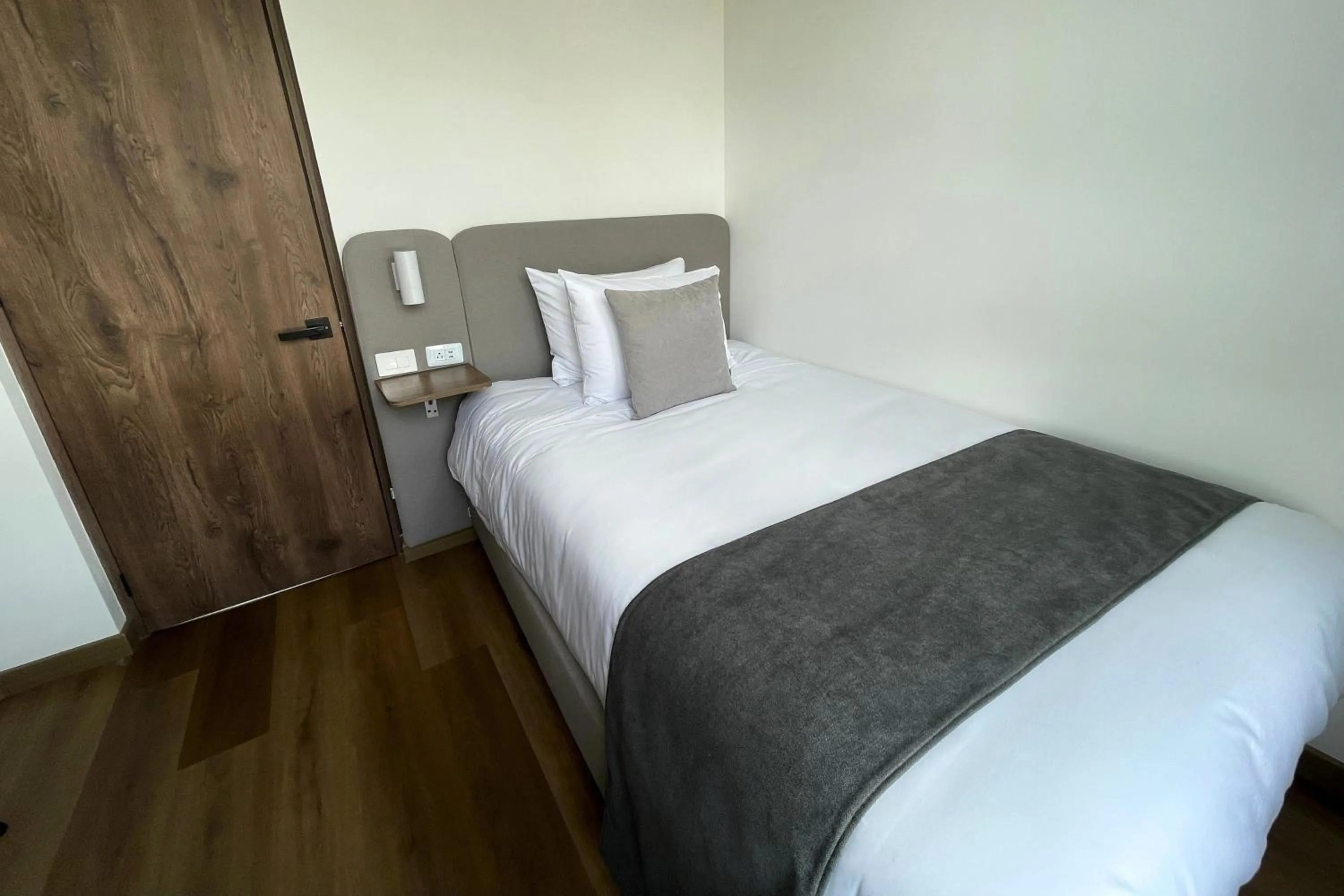 Bed in VOU Suites by Avia Suites