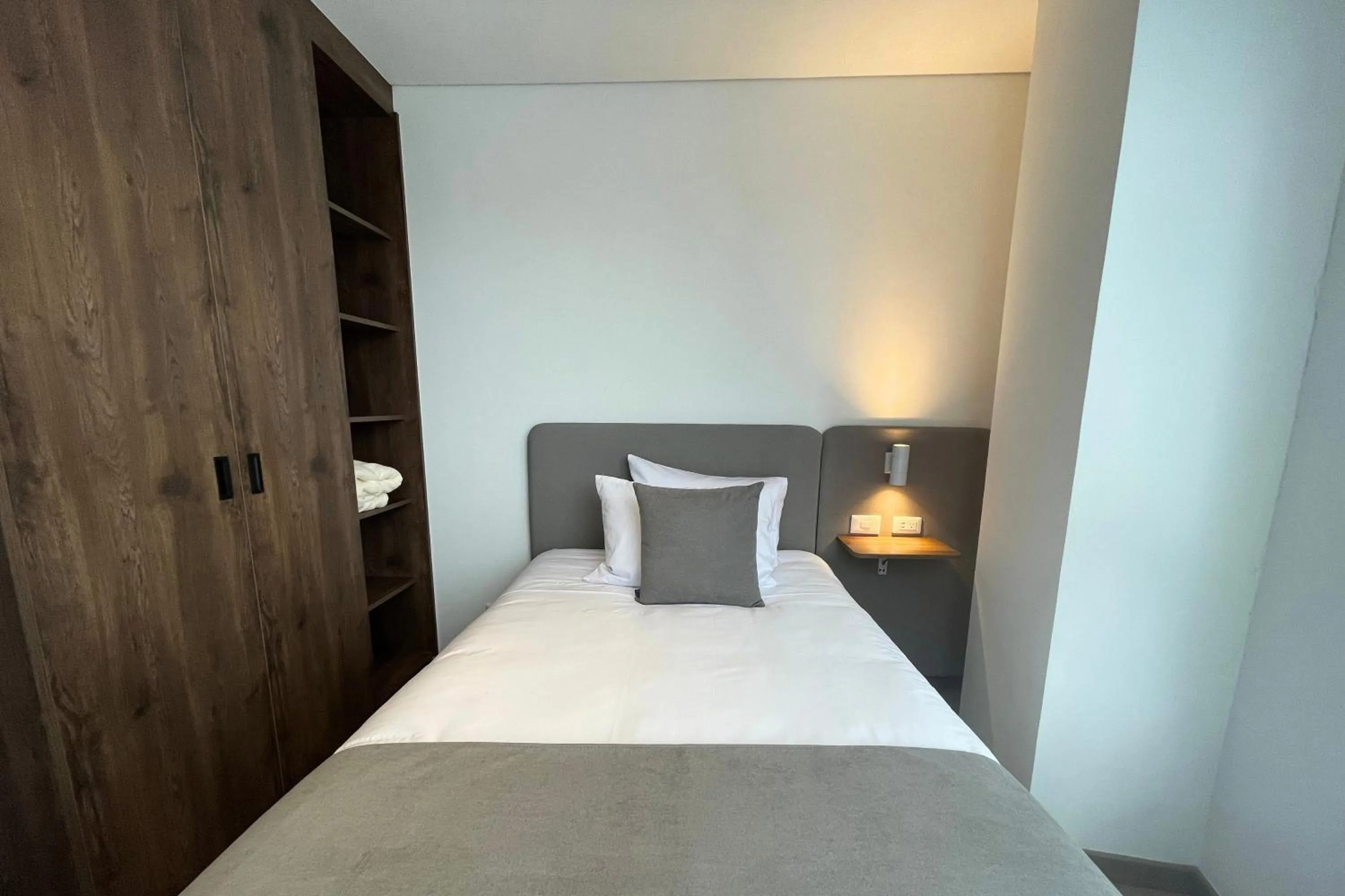 Bed in VOU Suites by Avia Suites