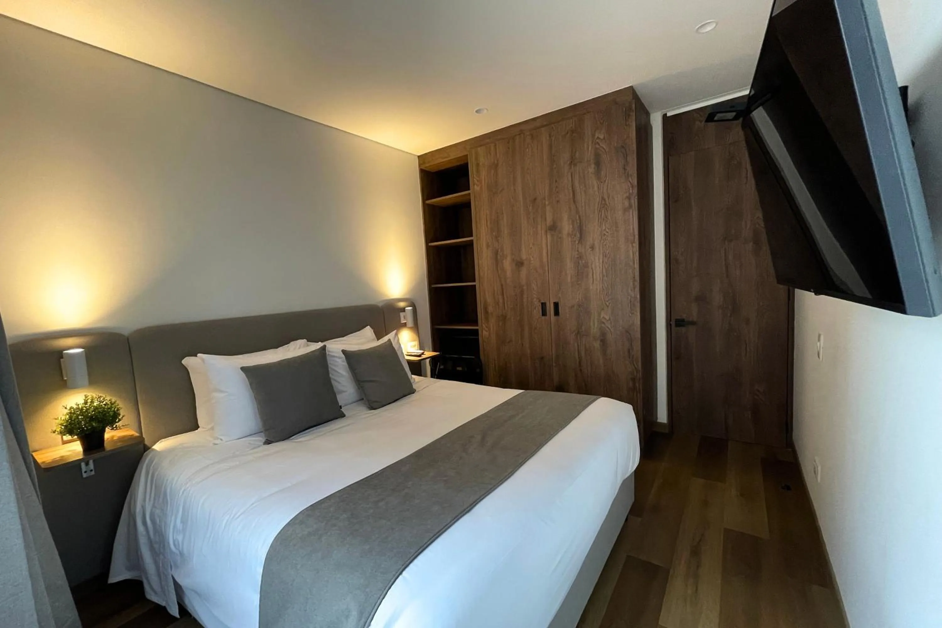 Bed in VOU Suites by Avia Suites