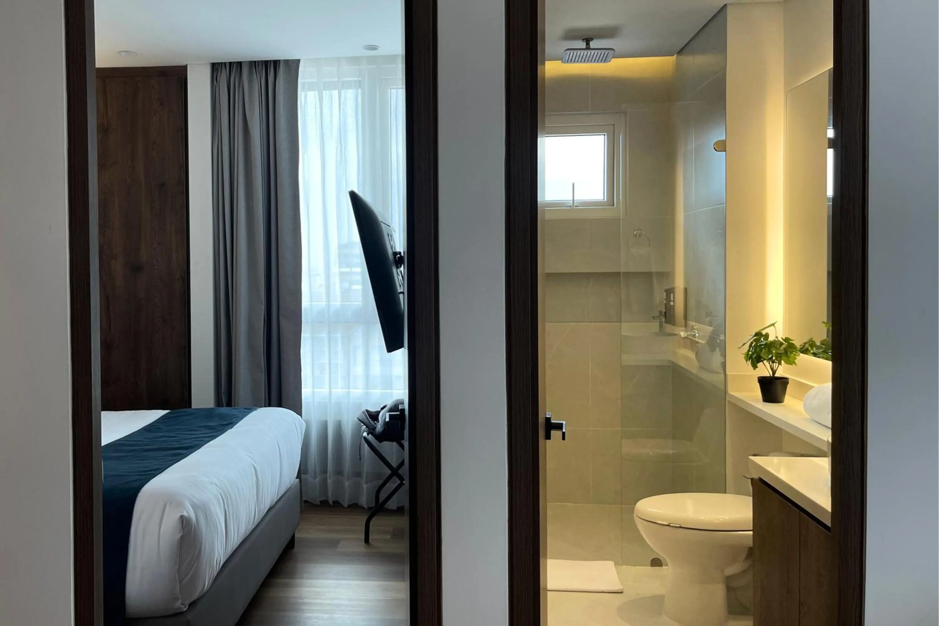 Bedroom, Bed in VOU Suites by Avia Suites