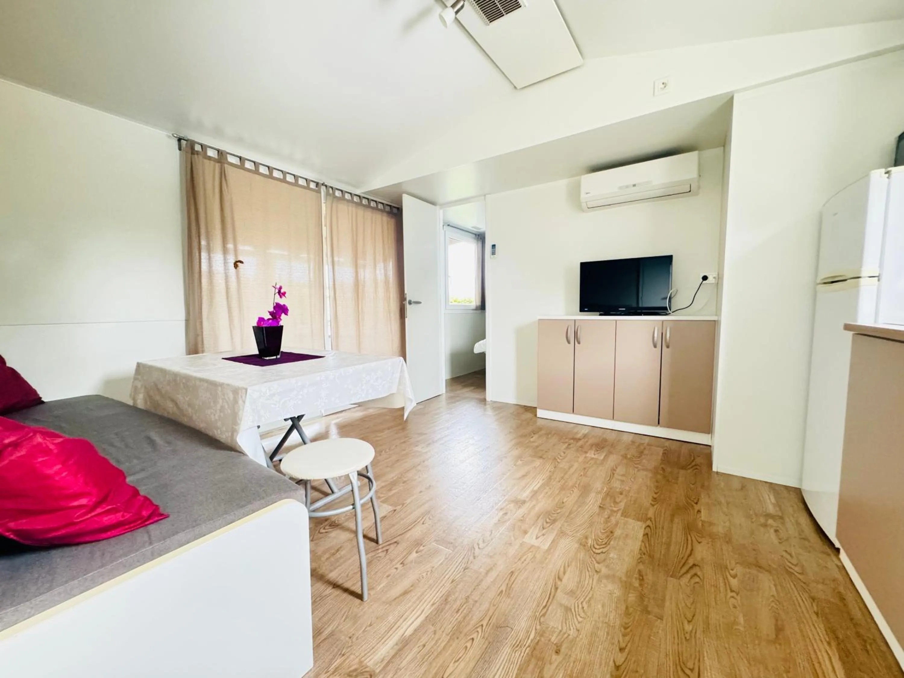 Living room, Bed in Mobile Homes Relax Park Umag