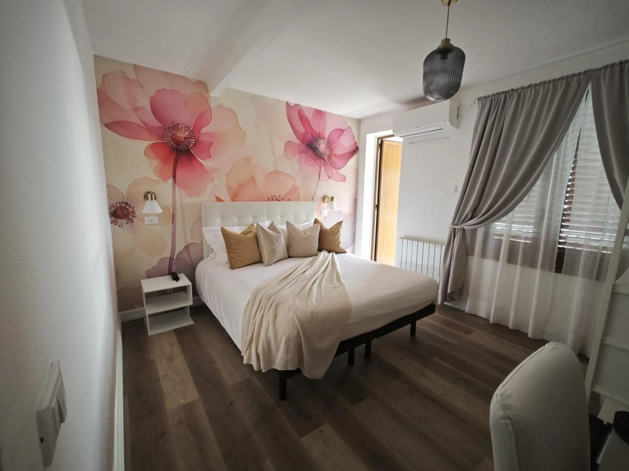 Bed in Villa Greta Hotel Rooms & Suites