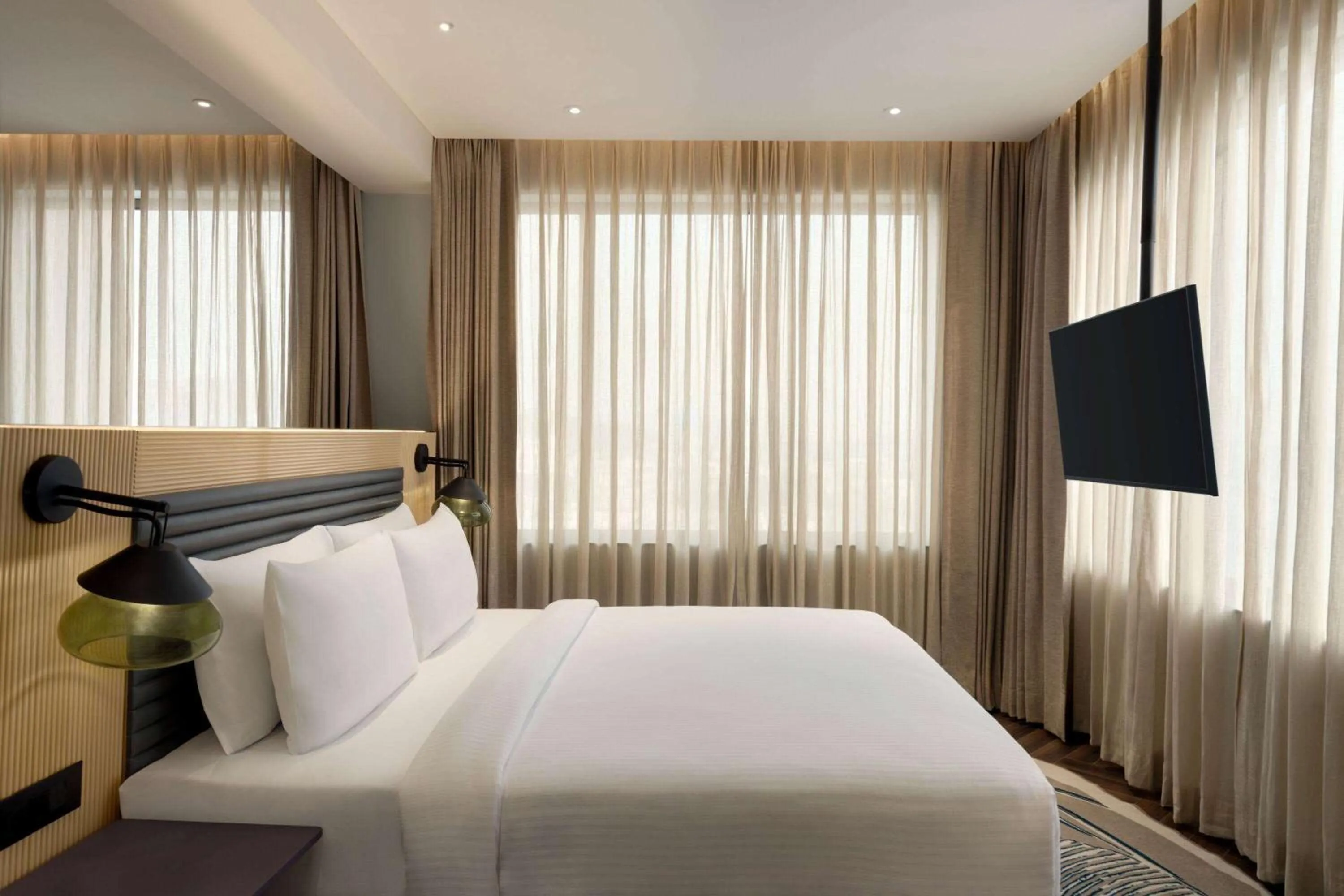 Photo of the whole room, Bed in Ramada Encore By Wyndham Bhiwadi Phool Bagh Chowk