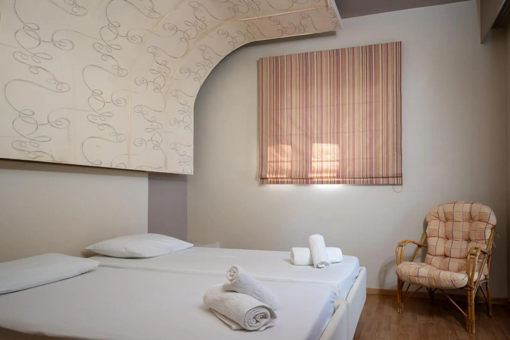 Bed in Triantafillas Suites