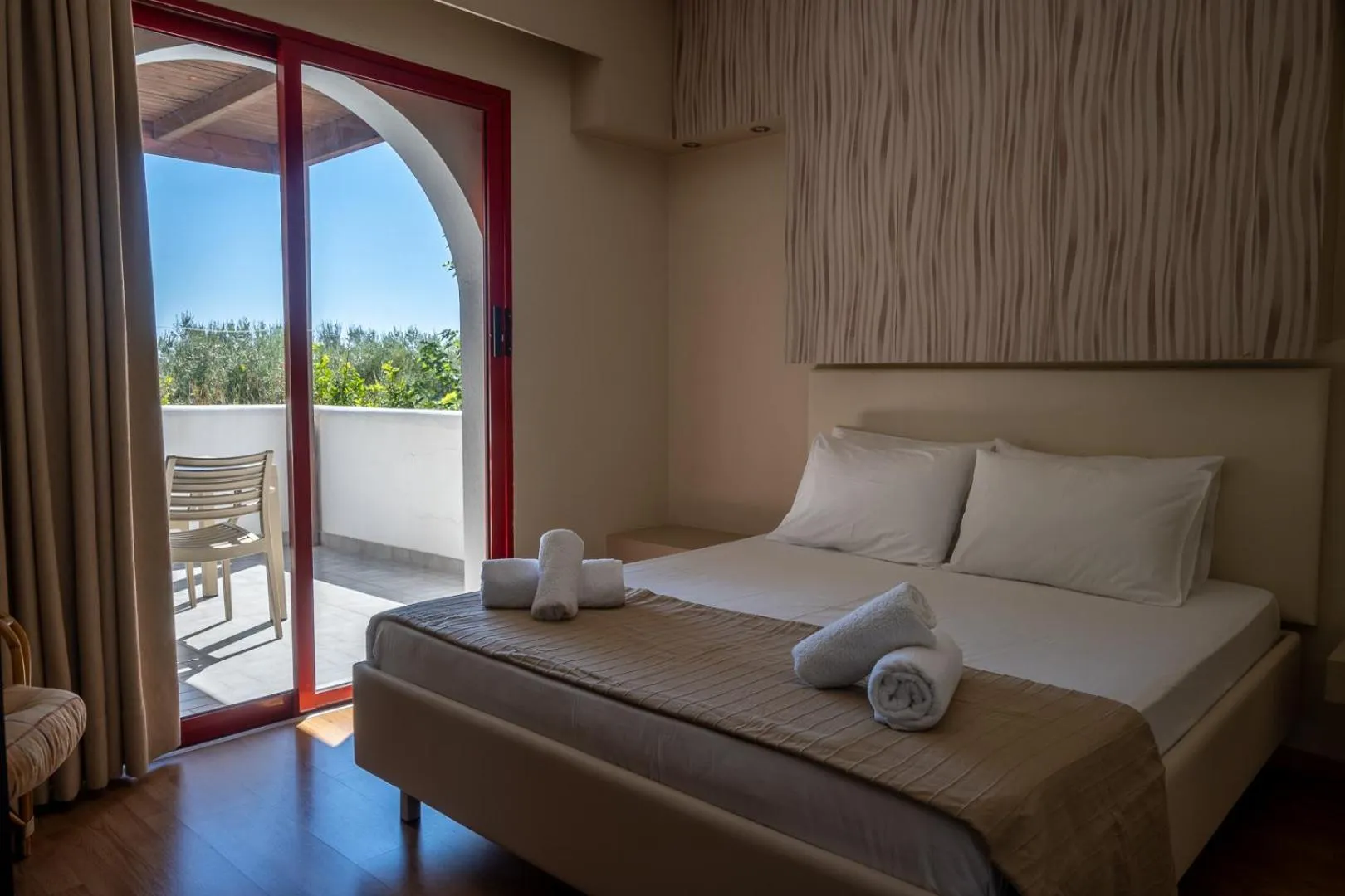 Bed in Triantafillas Suites