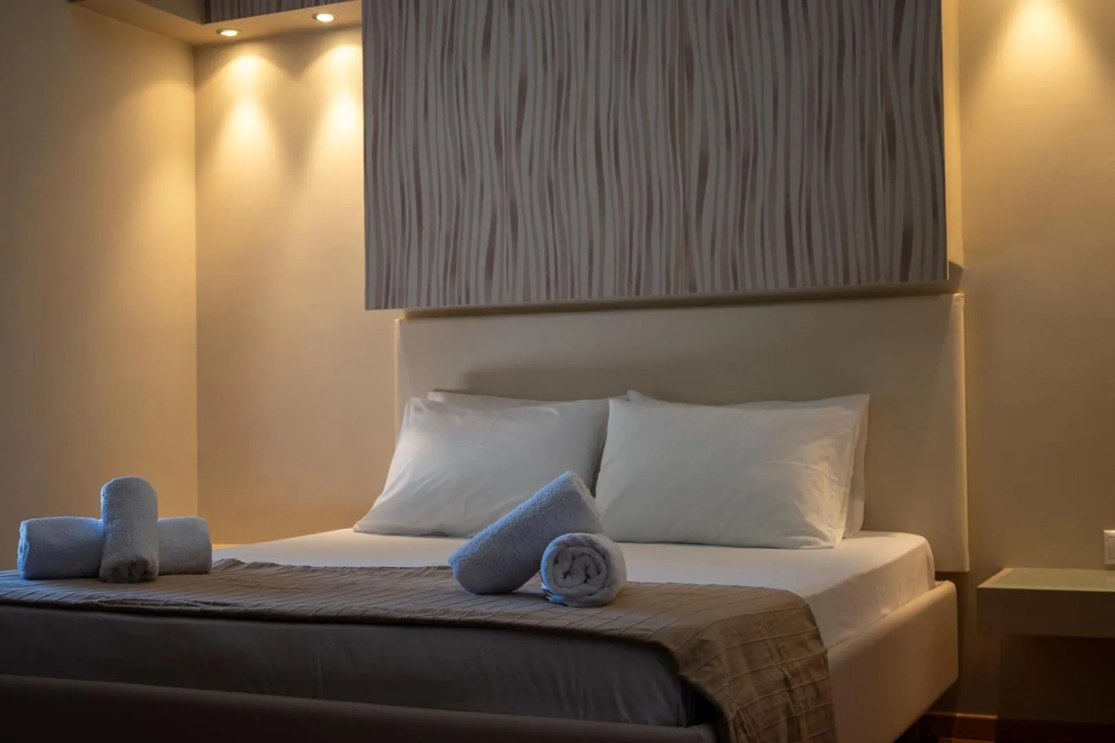 Bed in Triantafillas Suites