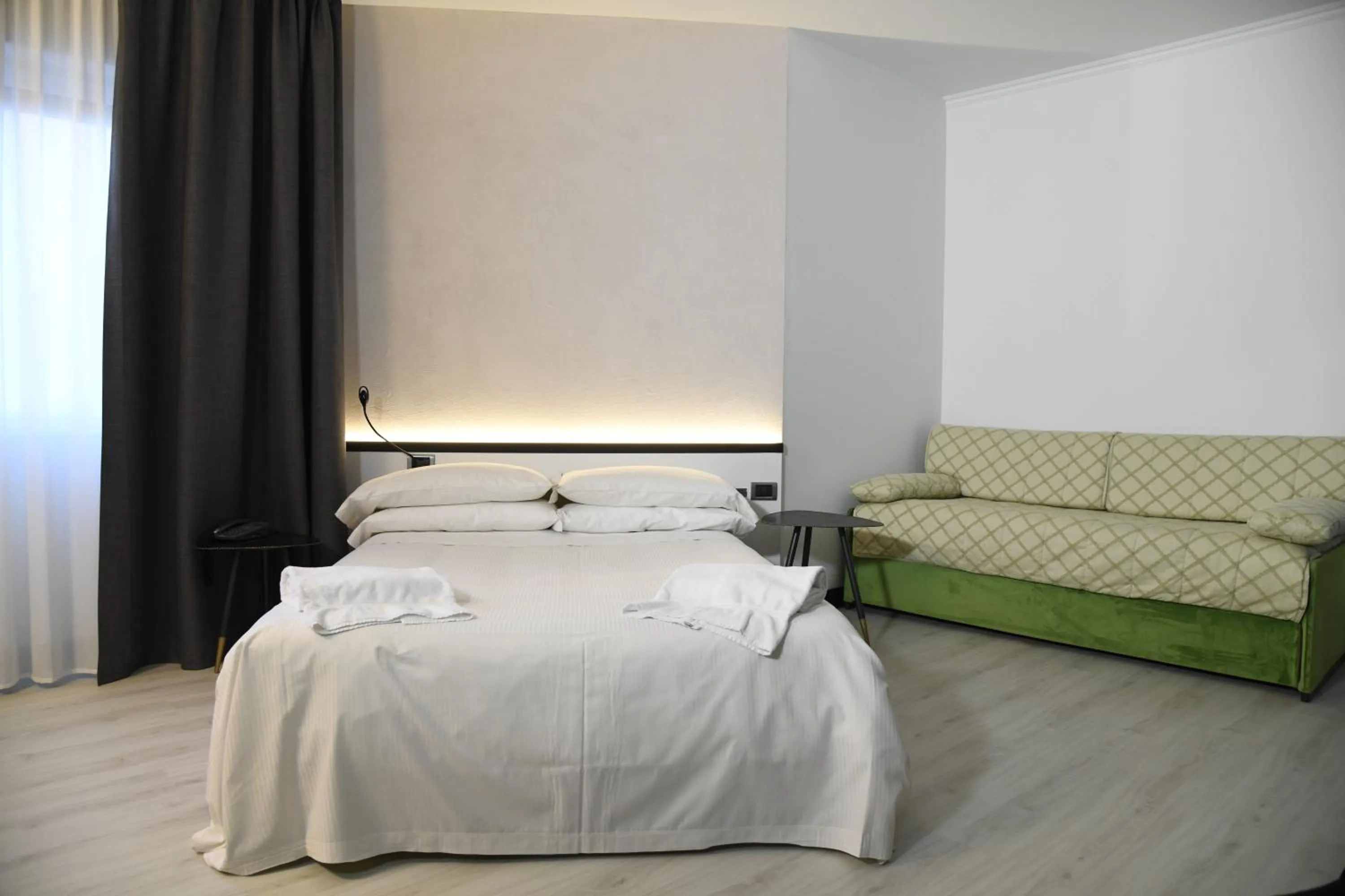 Bed in Brianteo Hotel Residence and Restaurant