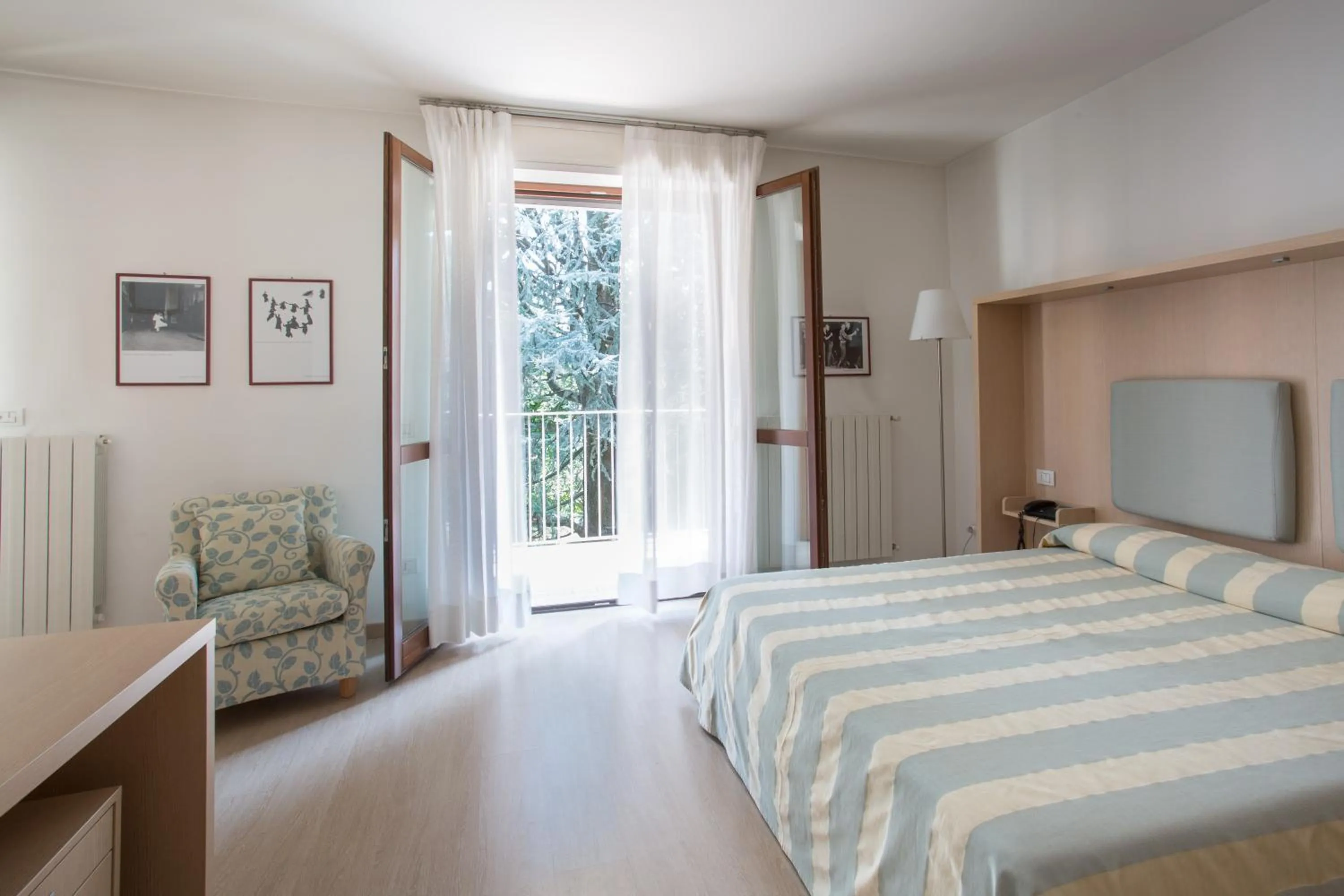 Photo of the whole room, Bed in Brianteo Hotel Residence and Restaurant