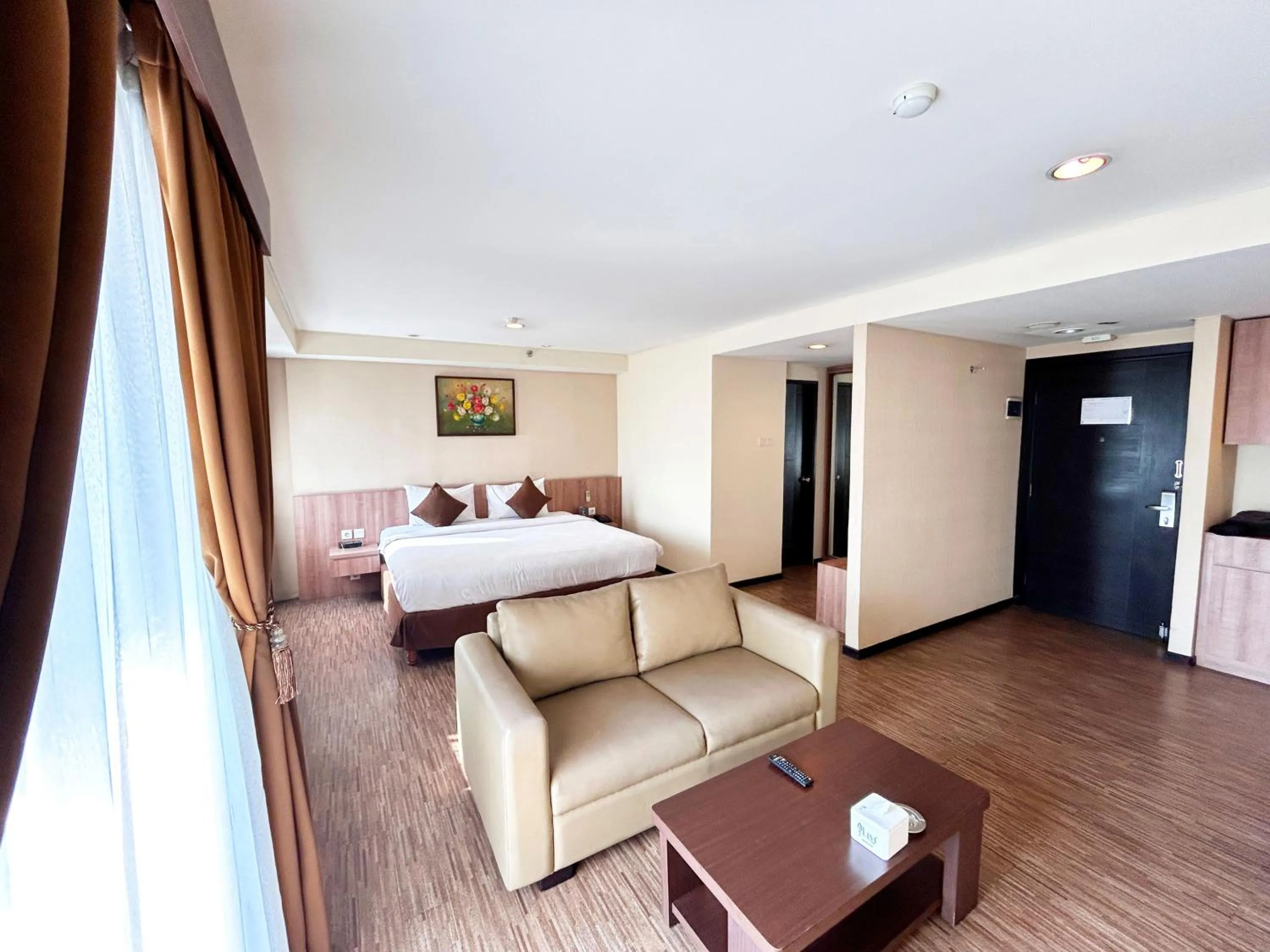 Living room, Bed in Grand Serpong Hotel
