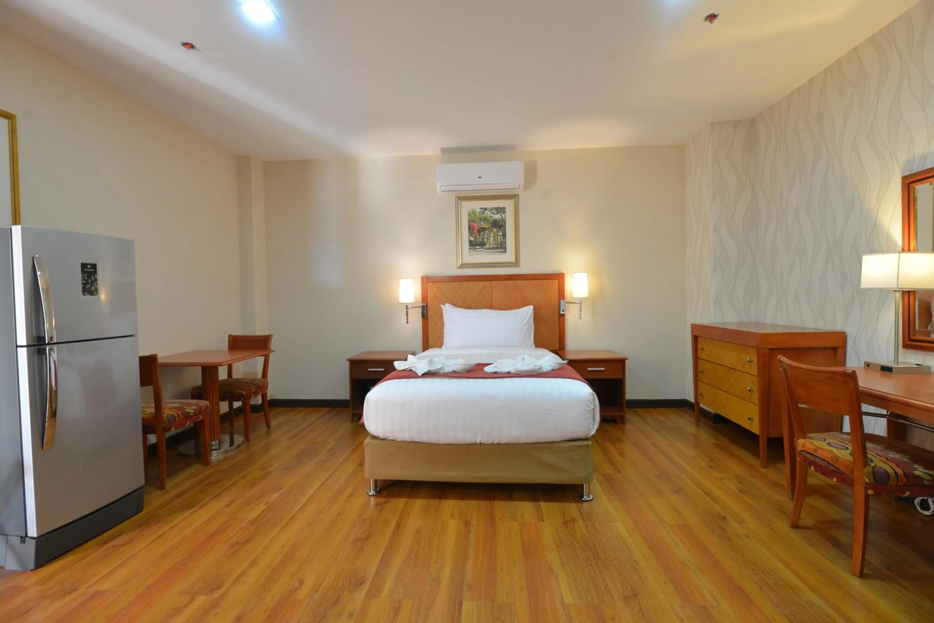 Bed in Royal Suites Condotel