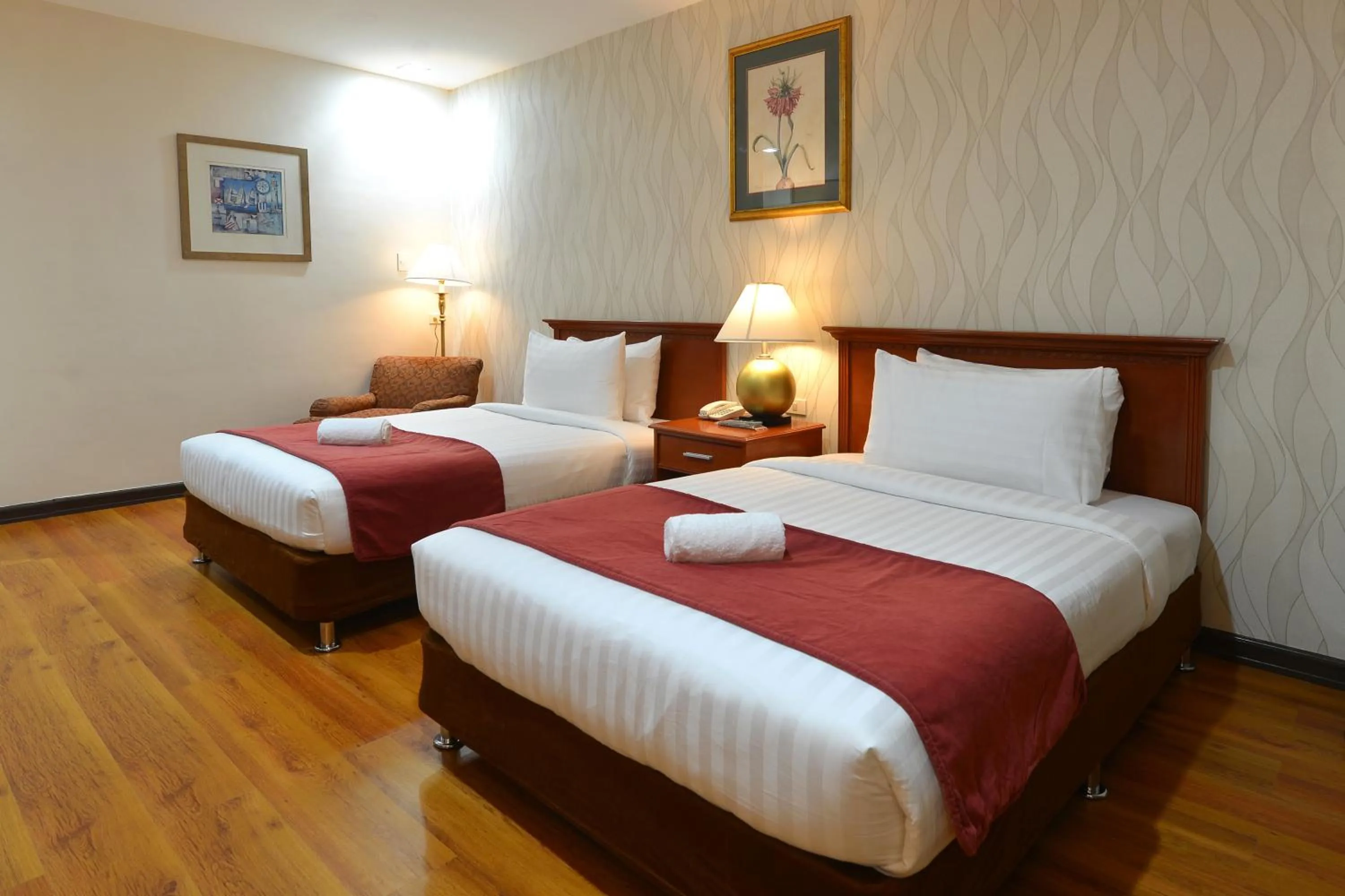 Bed in Royal Suites Condotel