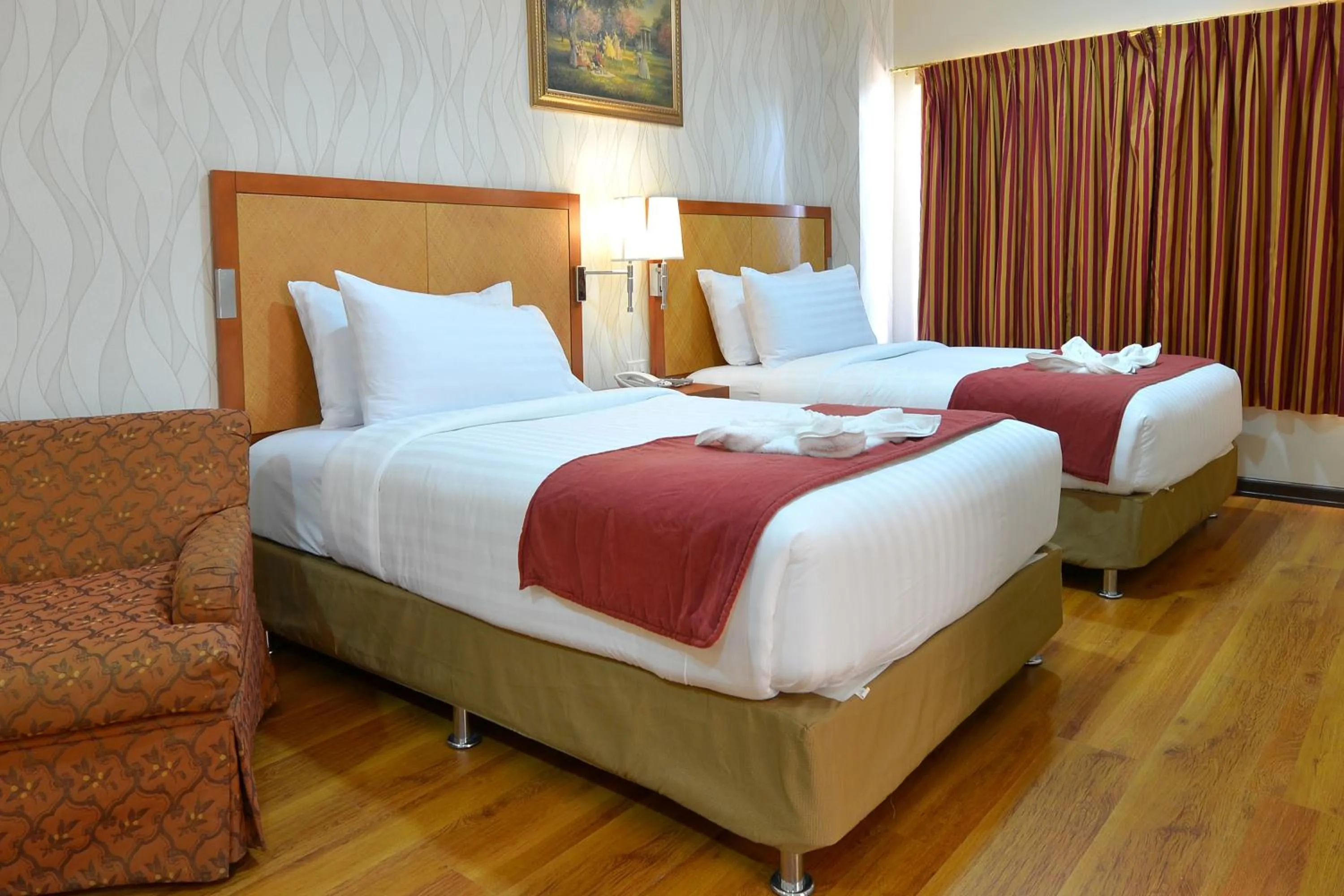 Bed in Royal Suites Condotel