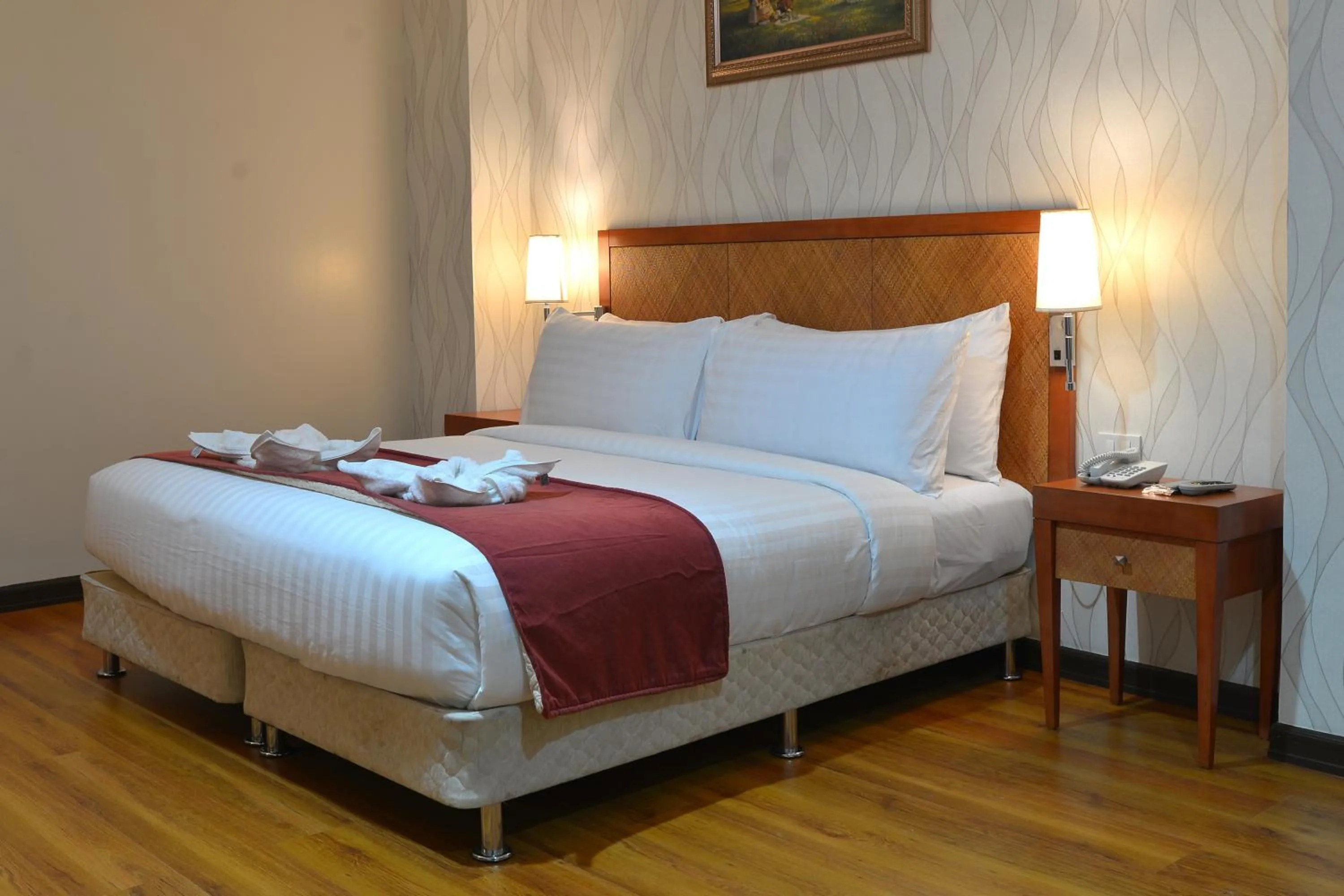 Bed in Royal Suites Condotel