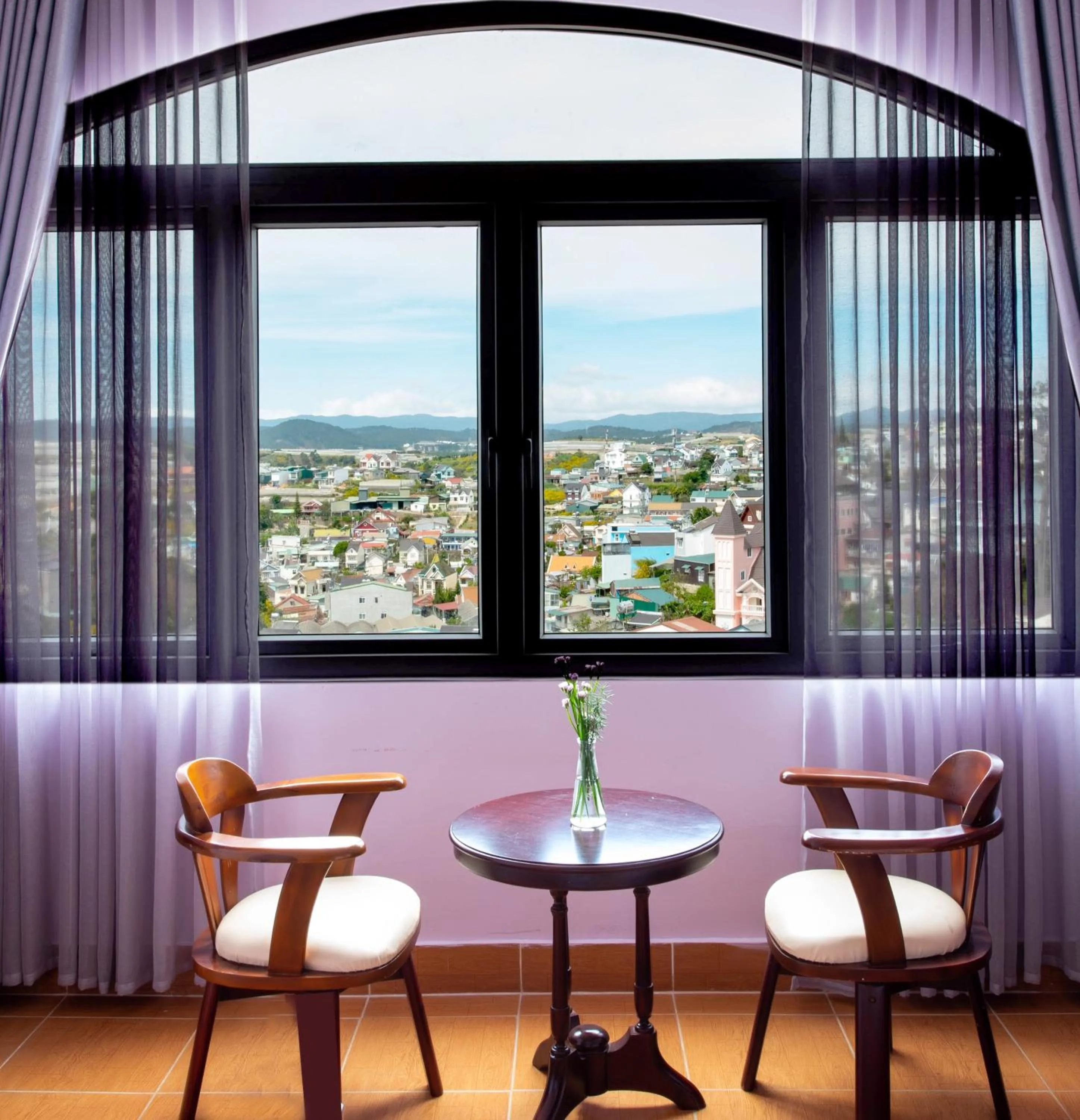 Bedroom in Le Petit Paris Dalat Hotel