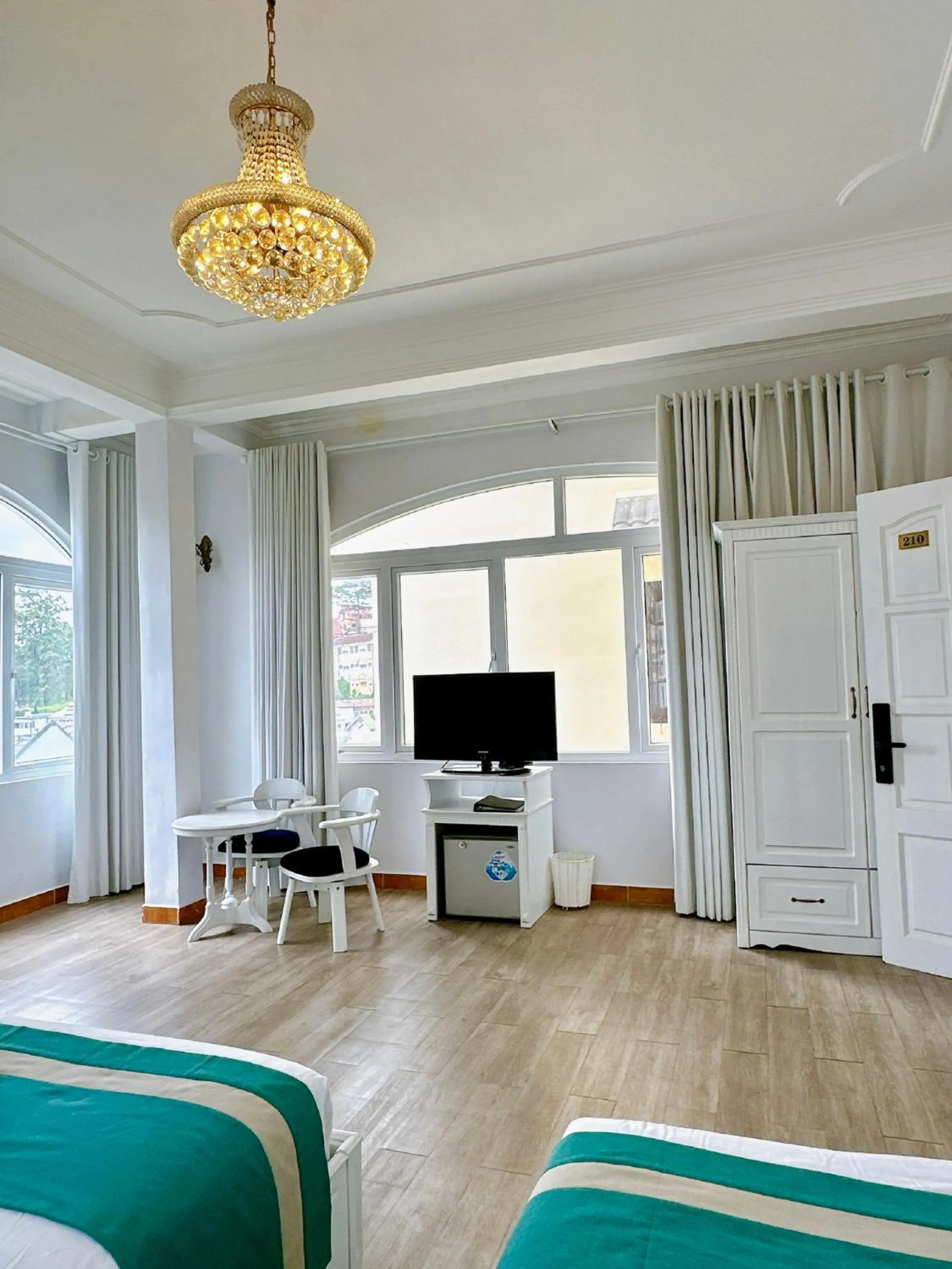 Bedroom in Le Petit Paris Dalat Hotel