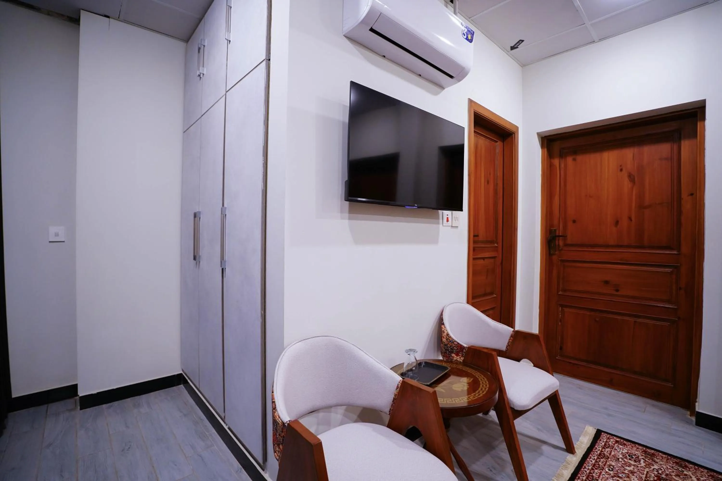 Communal lounge/ TV room in Luxvill Hotel