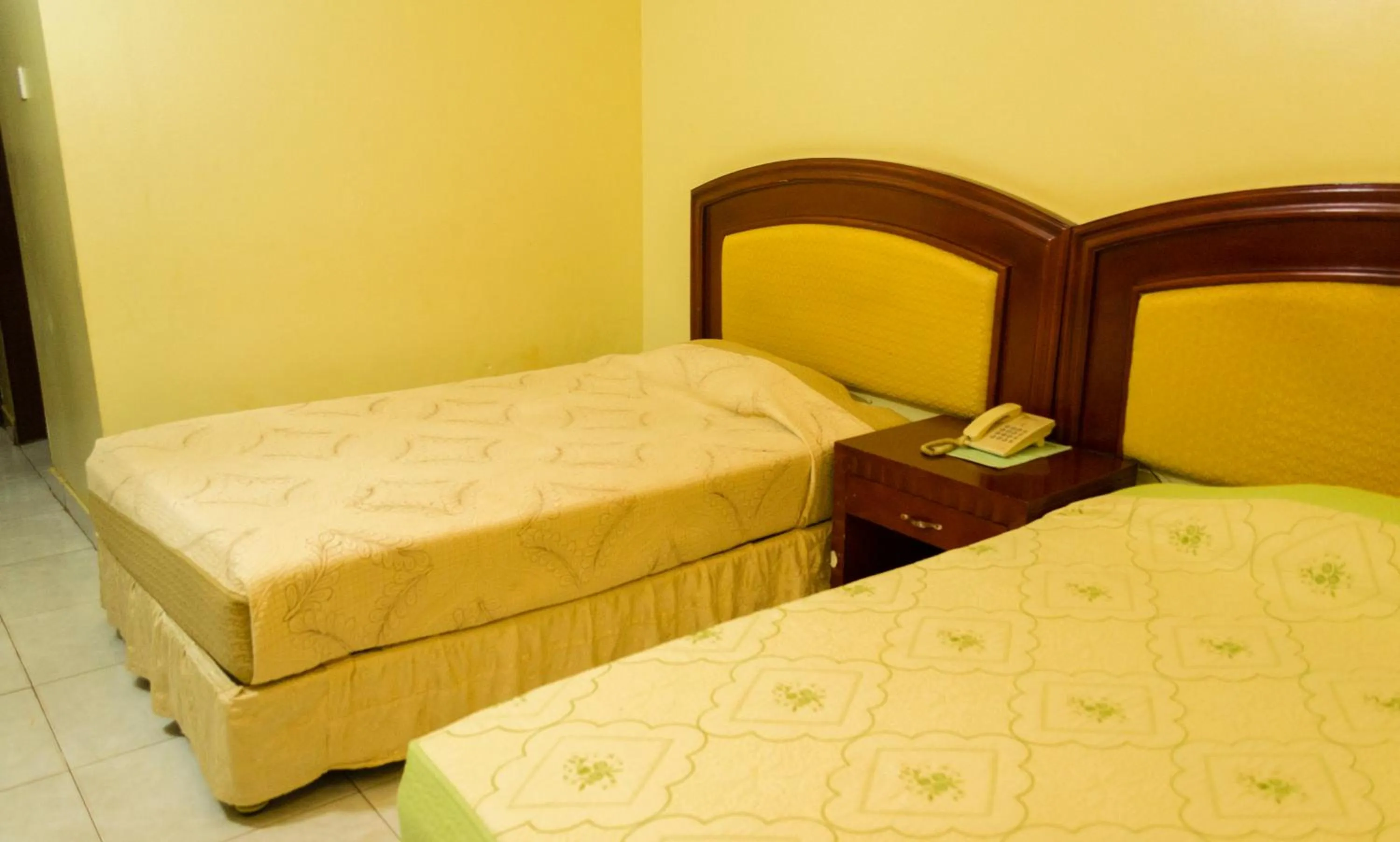 Bed in Emerald Hotel Kampala