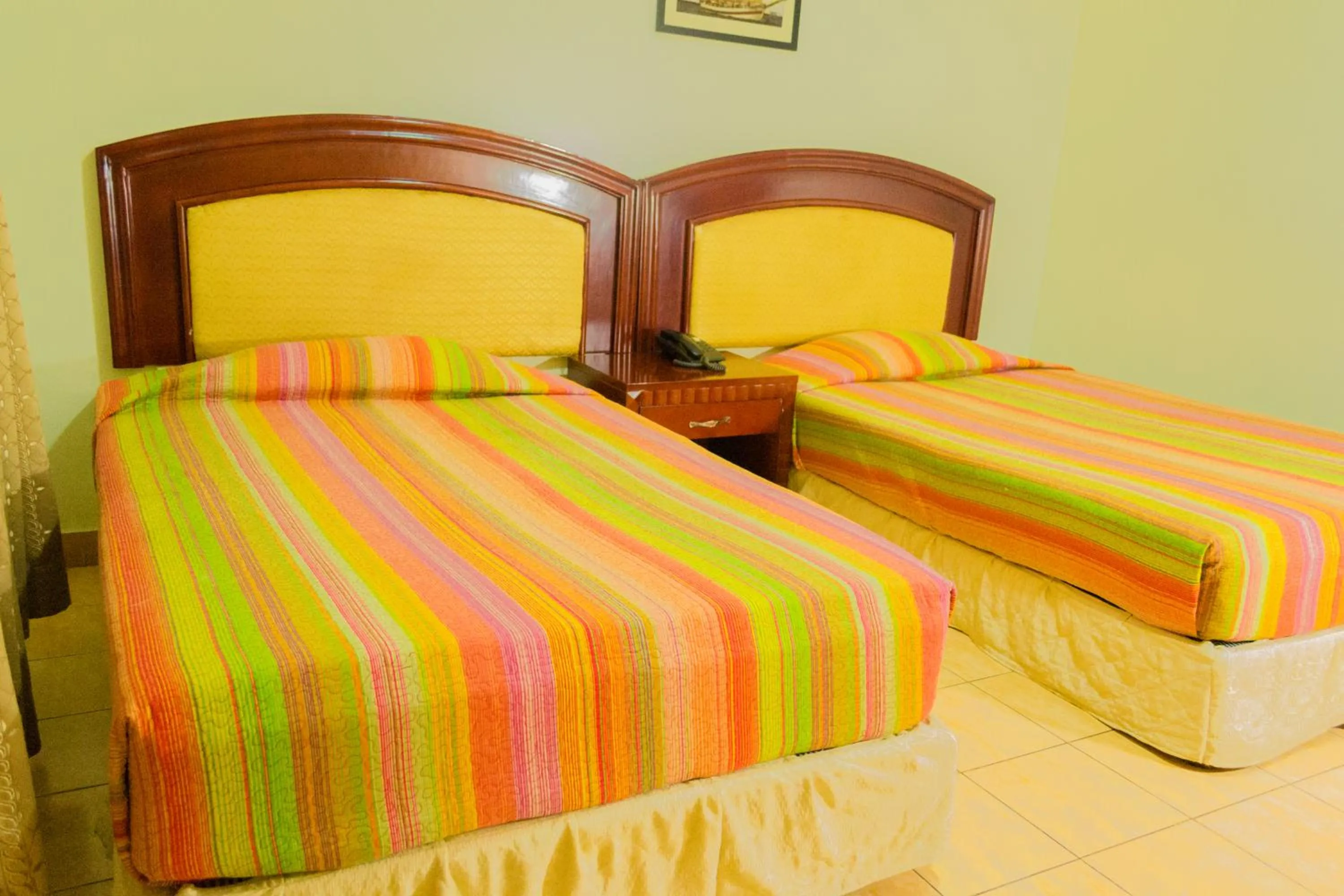 Bed in Emerald Hotel Kampala