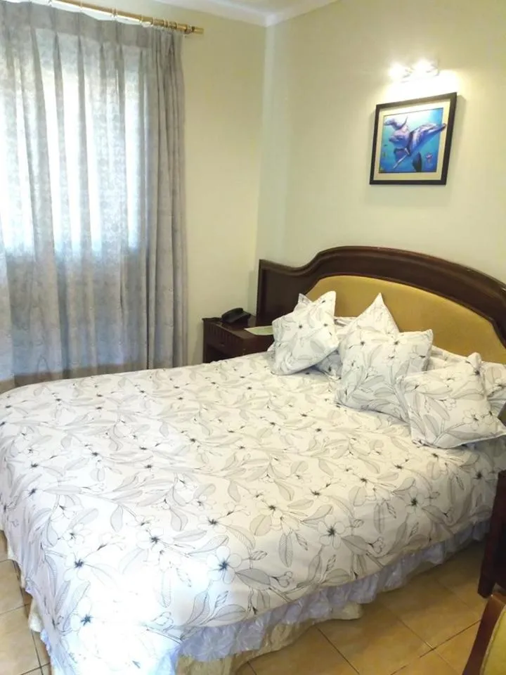 Bed in Emerald Hotel Kampala