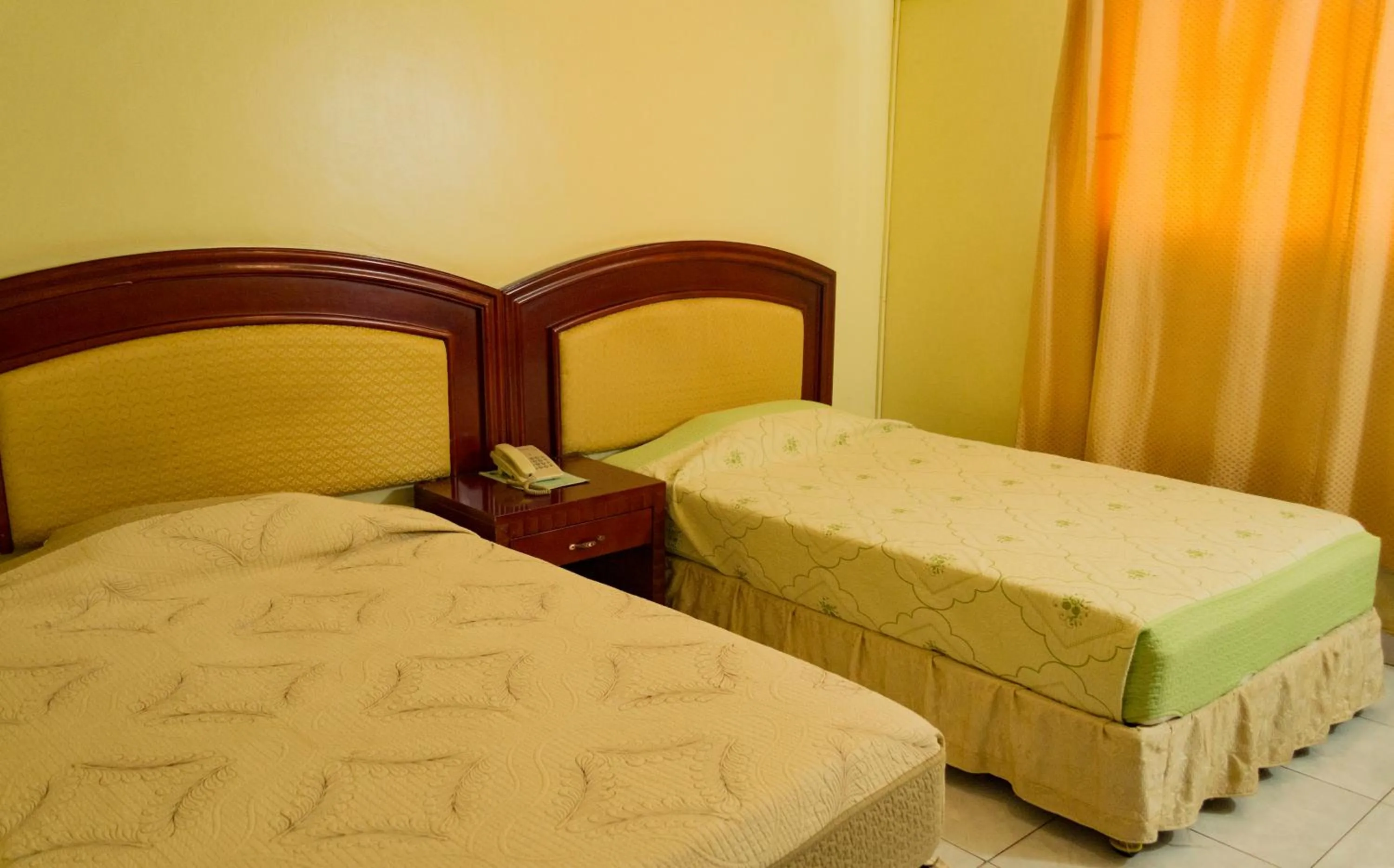 Bed in Emerald Hotel Kampala