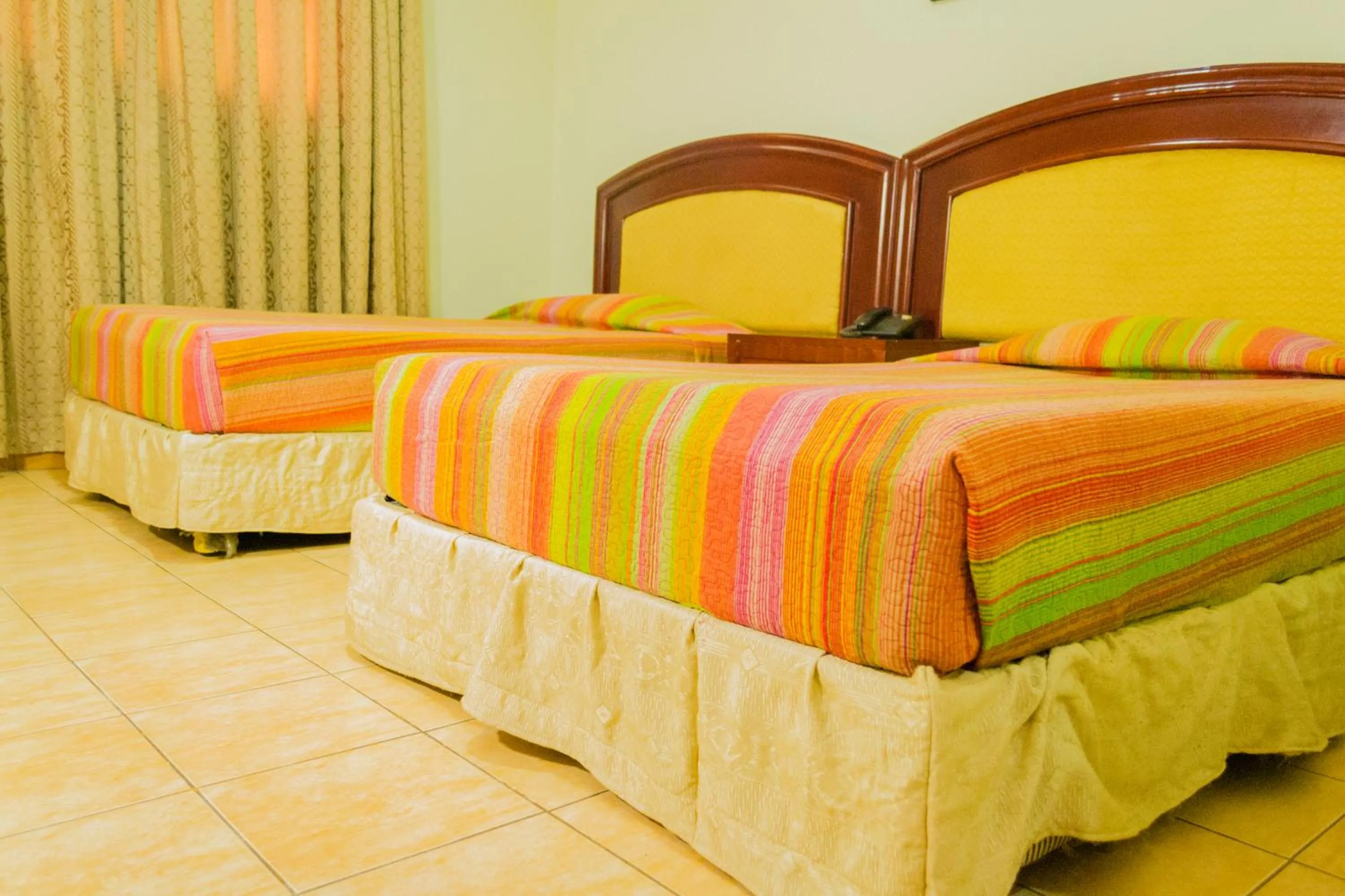 Bed in Emerald Hotel Kampala