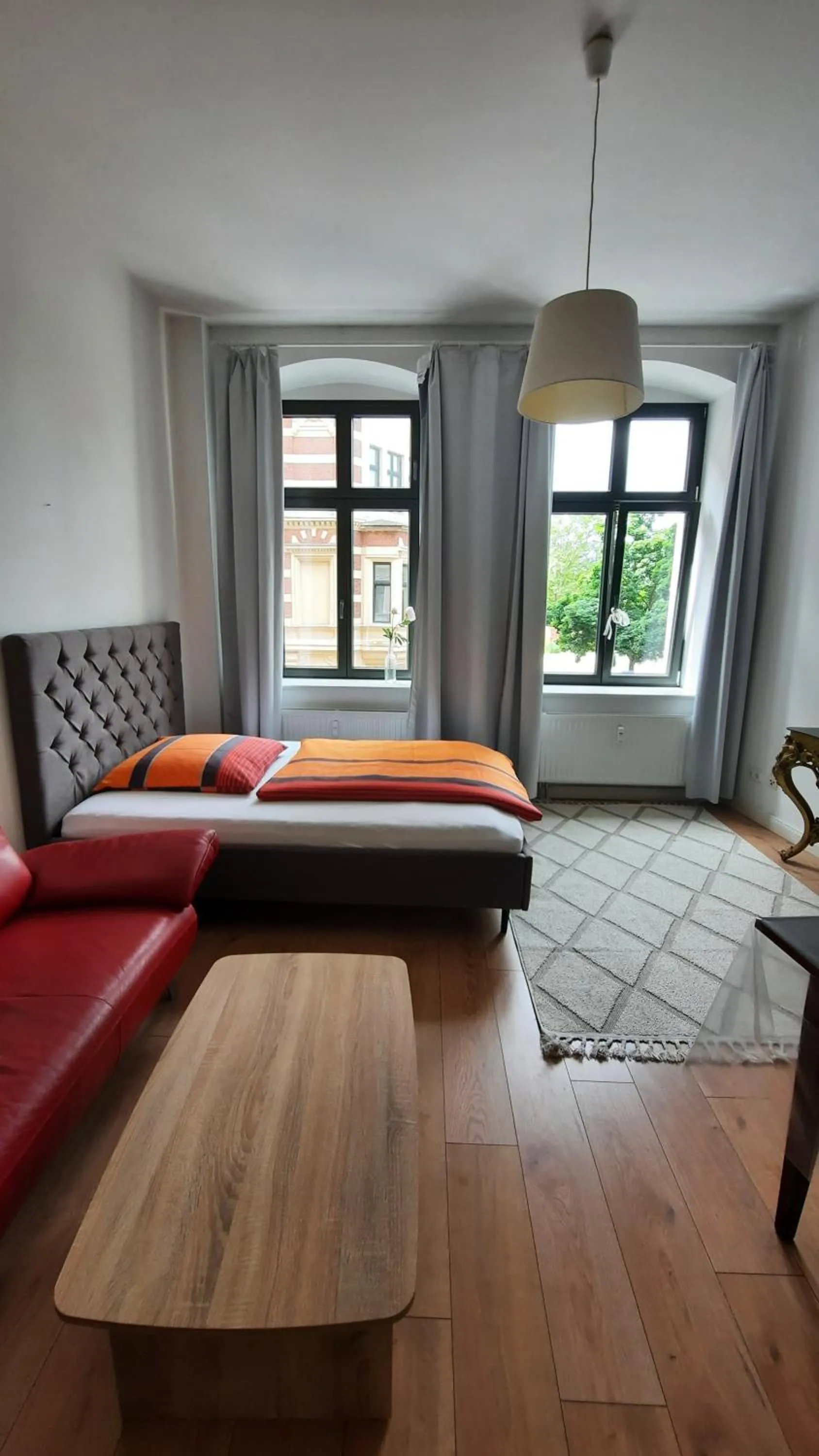 Living room, Bed in City Apartments Magdeburg
