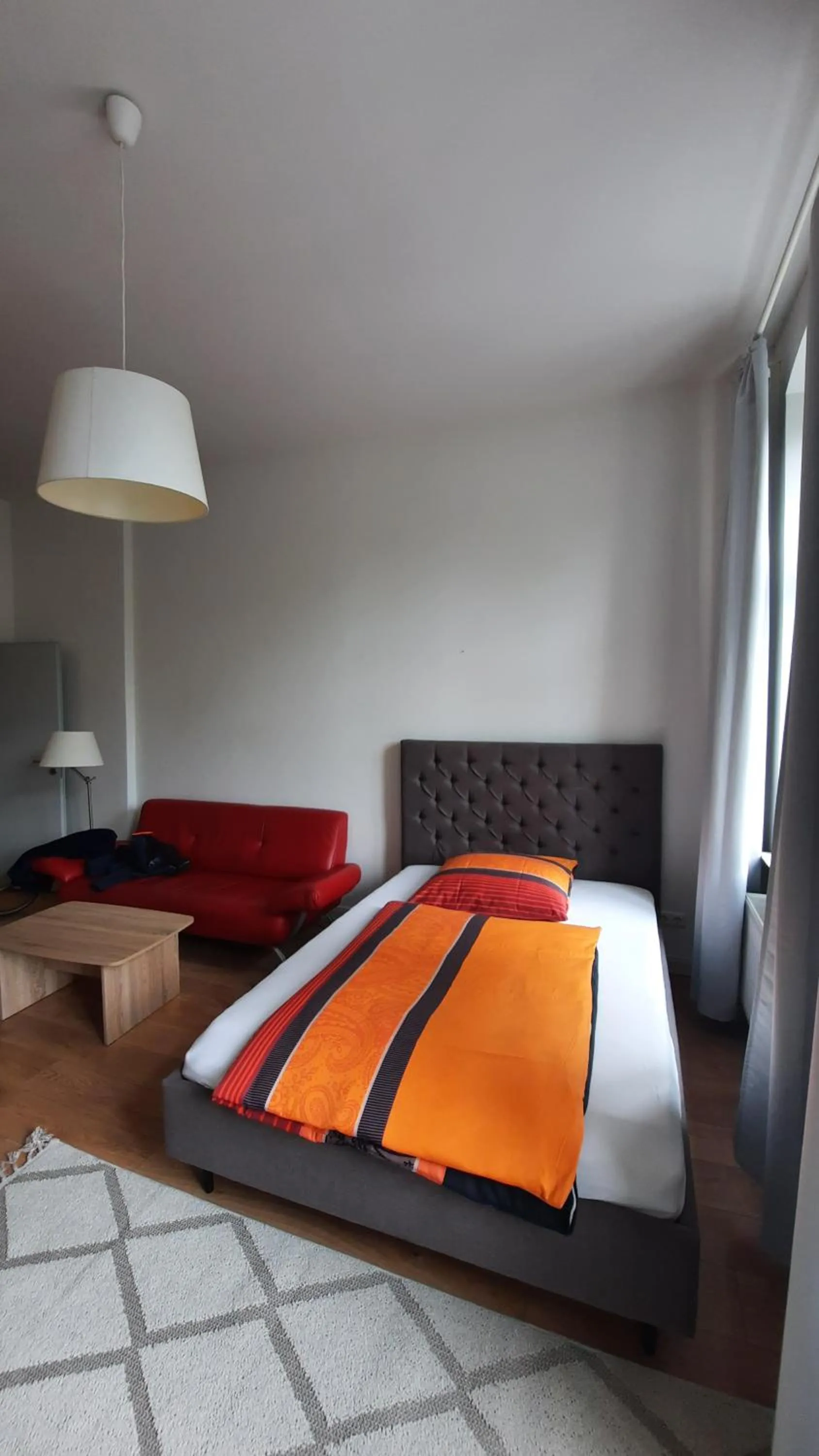 Living room, Bed in City Apartments Magdeburg