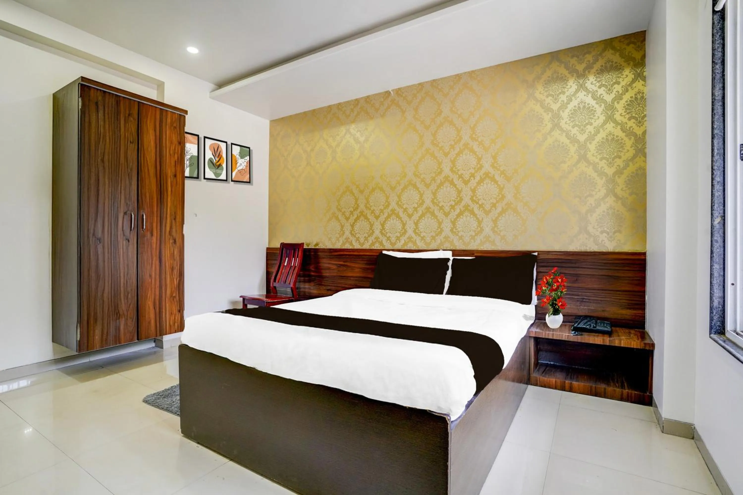 Bedroom, Bed in Super Townhouse Godavari Riverbank Formerly Shanti Datta Inn