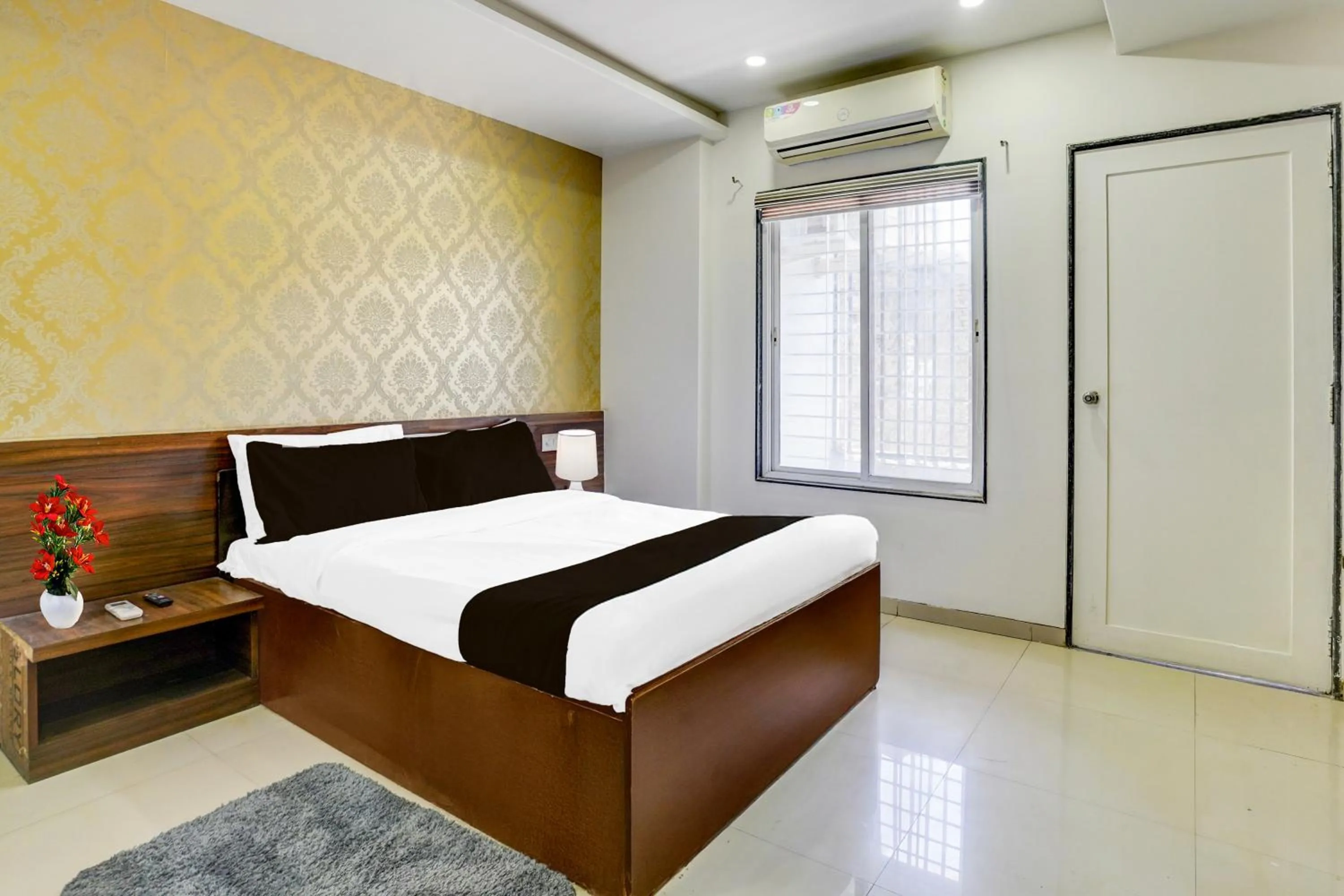 Bedroom, Bed in Super Townhouse Godavari Riverbank Formerly Shanti Datta Inn