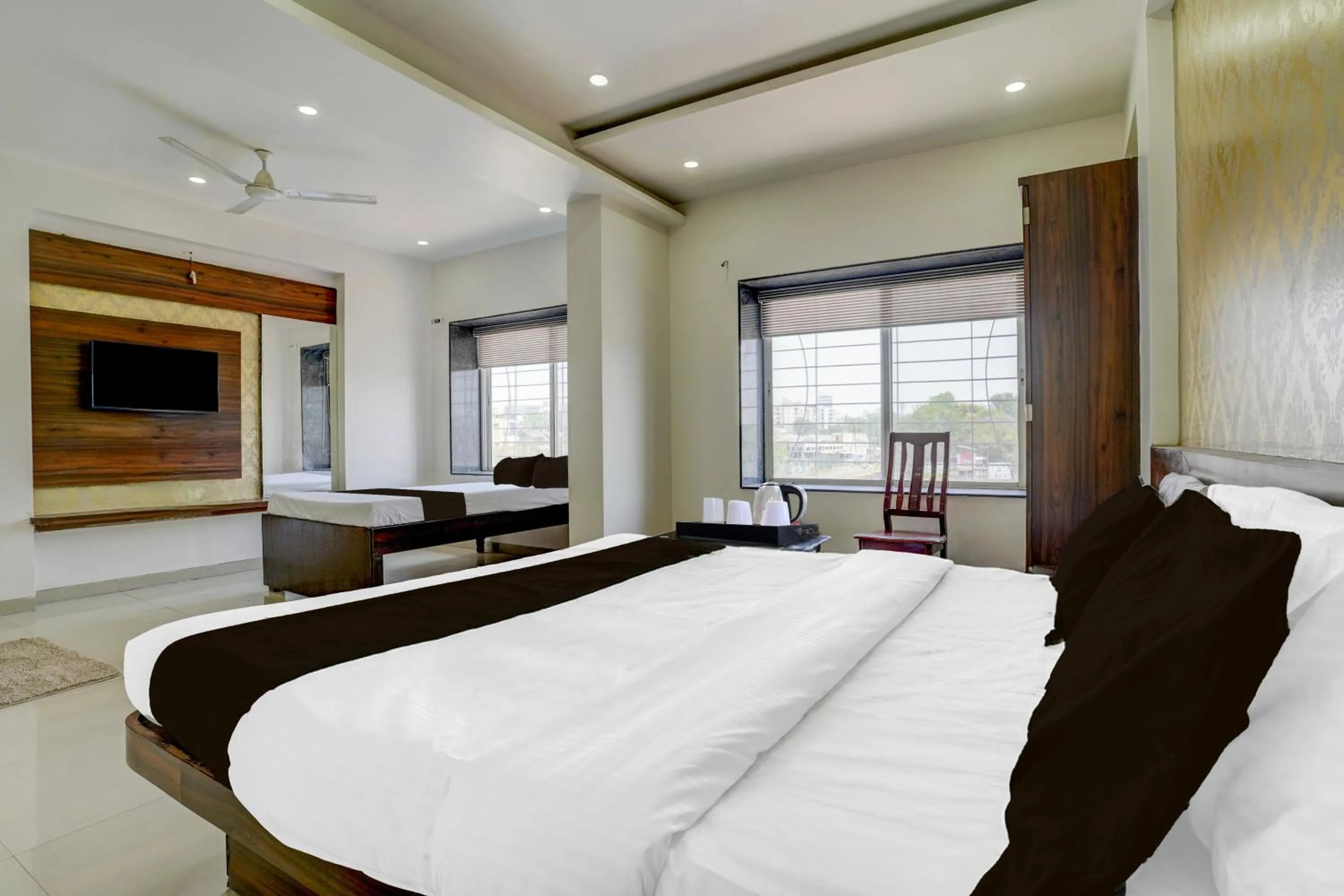 Bedroom, Bed in Super Townhouse Godavari Riverbank Formerly Shanti Datta Inn