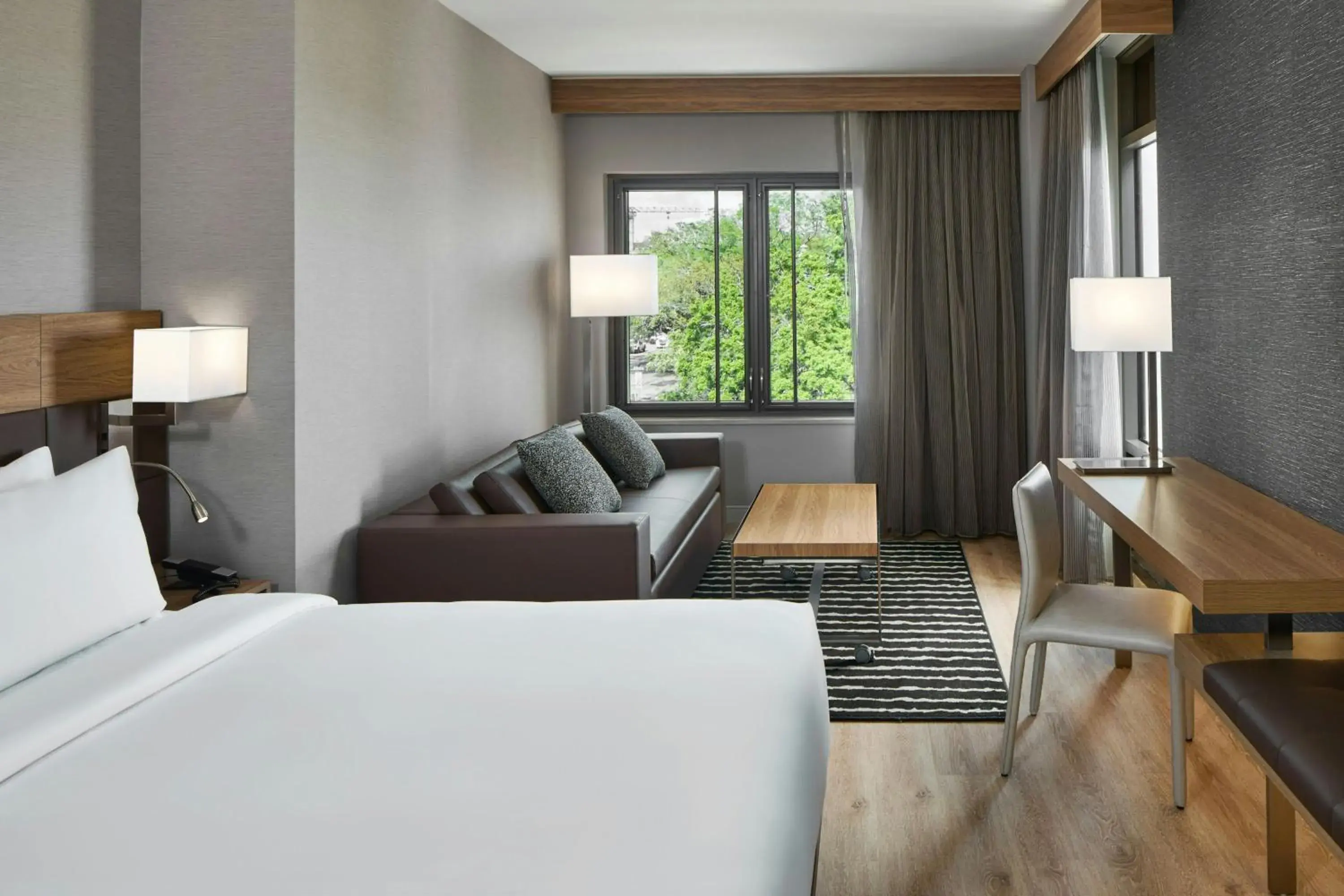 Deluxe King Room with Sofa Bed and River View in AC Hotel Savannah Historic District Deluxe King Room with Sofa Bed and River View in AC Hotel Savannah Historic District