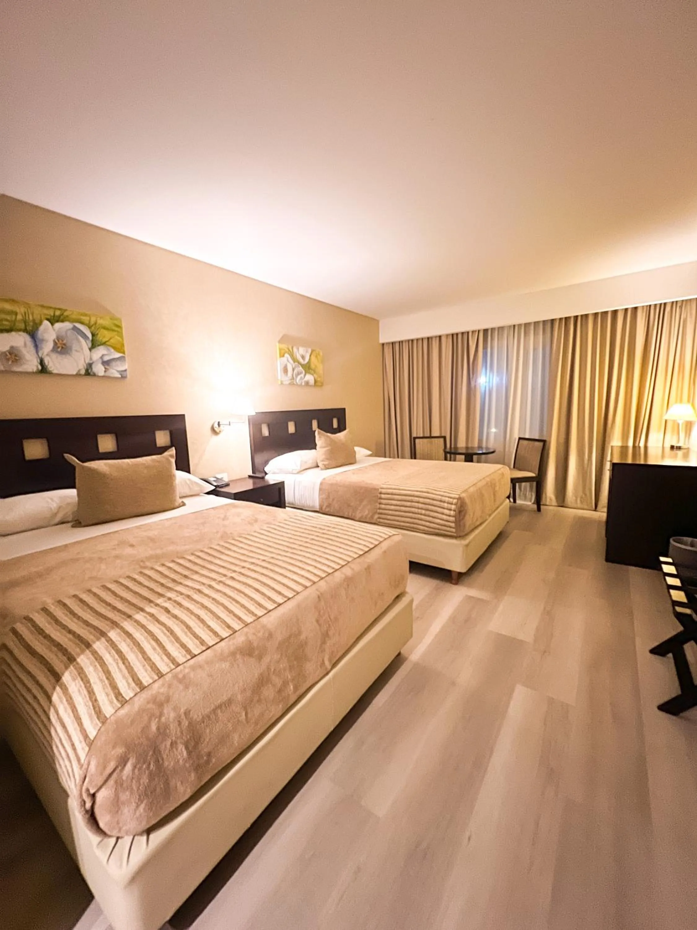 Bed in Howard Johnson Hotel & Resort Funes